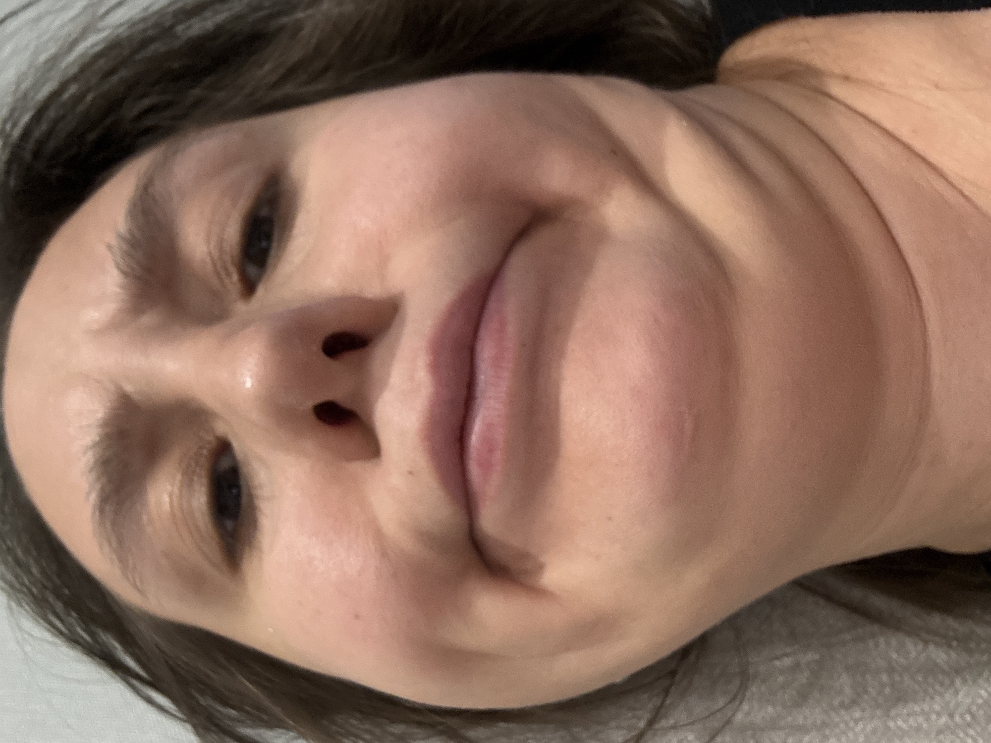 A close-up, slightly rotated image depicts a person's face and part of their neck and upper torso. The person has light skin, dark hair, and neutral facial expression. No location information about Zelenogradsk, Russia can be discerned from the image.
