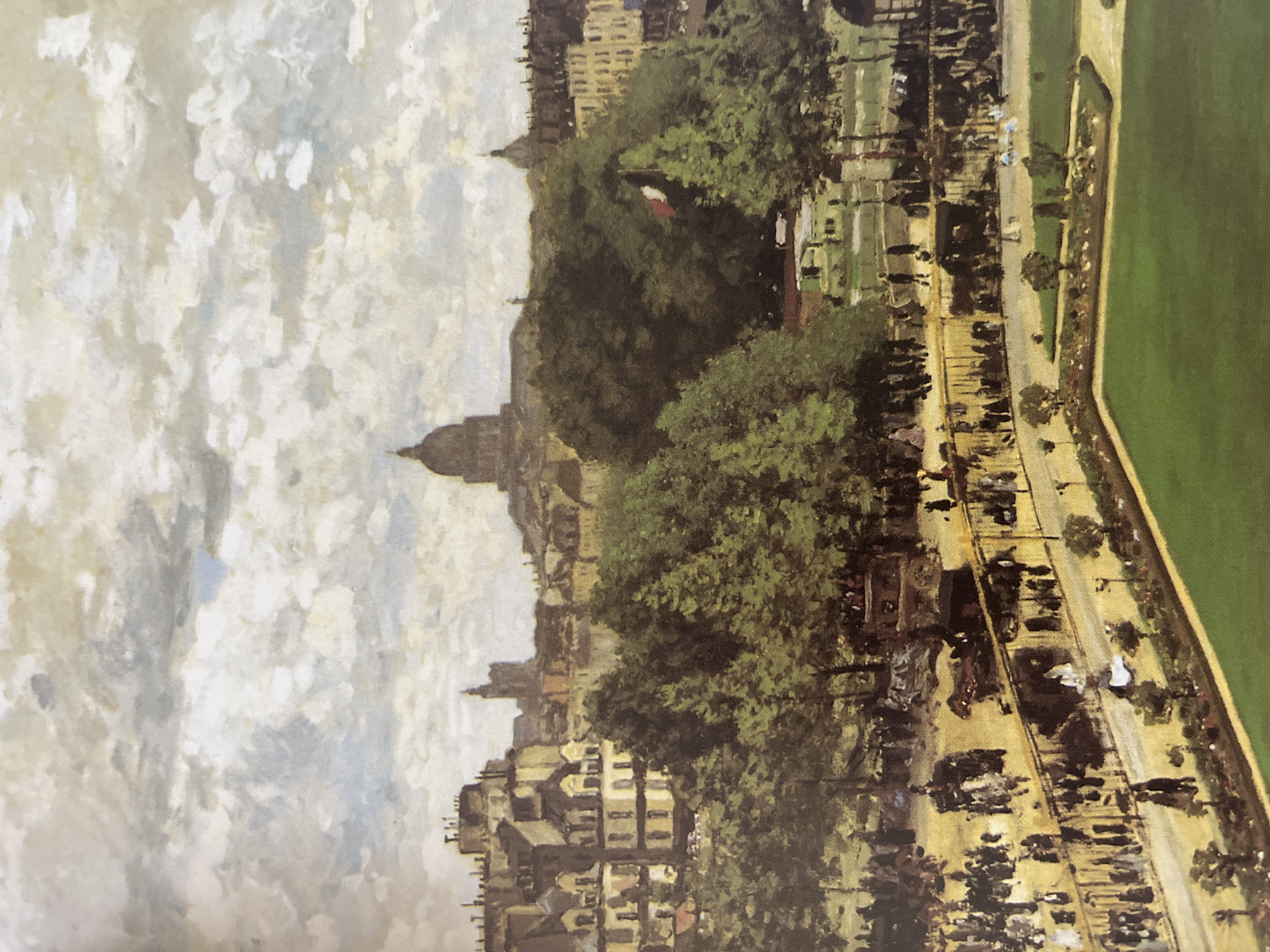 The image depicts an Impressionist-style painting of a city scene. From an elevated perspective, a large park with a road runs along the right side of the frame. The road is lined with small trees and appears to have pedestrian and vehicular traffic. Beyond the park and road are large trees and buildings, indicating a city setting. A tall domed building rises in the middle of the skyline. The sky is filled with cumulus clouds. No location information for Varna, Bulgaria, is present.