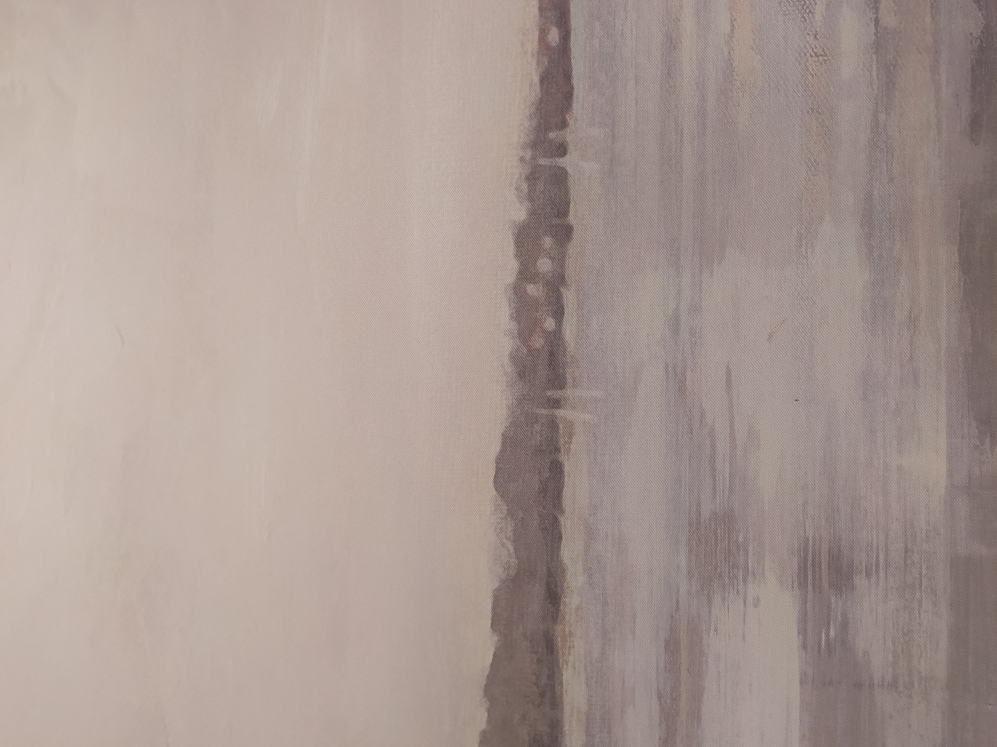 A landscape painting is depicted, featuring a hazy, muted color palette. The upper portion of the image is a pale, washed-out sky, transitioning into a darker, indistinct horizon line. Below the horizon, a body of water occupies the lower half of the frame, rendered with horizontal strokes of varying shades of gray and light purple. The water's surface reflects the subdued tones of the sky and the faint, silhouetted forms on the horizon. The overall impression is one of quietude and perhaps a touch of melancholy, with a soft, diffused light.