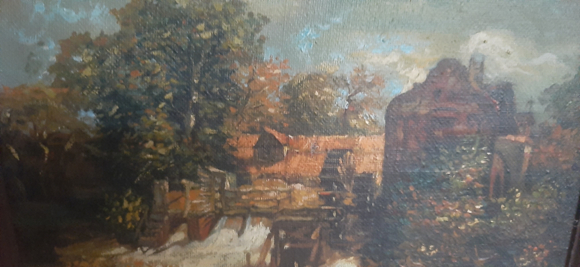 The painting depicts a rustic scene with a building in the foreground, possibly a mill, with a water wheel visible. The structure is made of reddish-brown material, and the surrounding vegetation is lush and varied in color, with hints of green, brown, and orange. A body of water, likely a river or canal, flows in front of the building, reflecting the surrounding landscape. Trees with dense foliage are present on the left side of the painting, their branches extending upwards. The sky is a mix of blue and white clouds, suggesting an overcast or partly cloudy day. In the distance, additional buildings with pitched roofs are visible, nestled amongst more trees. The overall impression is one of a tranquil, rural setting, characteristic of Yessentukskaya, Russia, known for its natural beauty and agricultural landscapes. There are no people or animals depicted in the painting.
