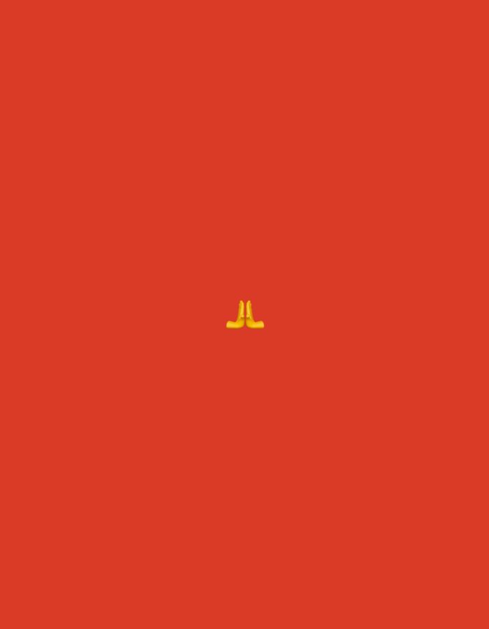 The image shows a minimalist composition with a plain red background. Centered in the middle of the frame is a yellow emoji depicting two hands pressed together in a prayer or greeting gesture. The emoji is the sole object in the image, and there are no discernible features of Plauen, Germany, or any urban environment present.