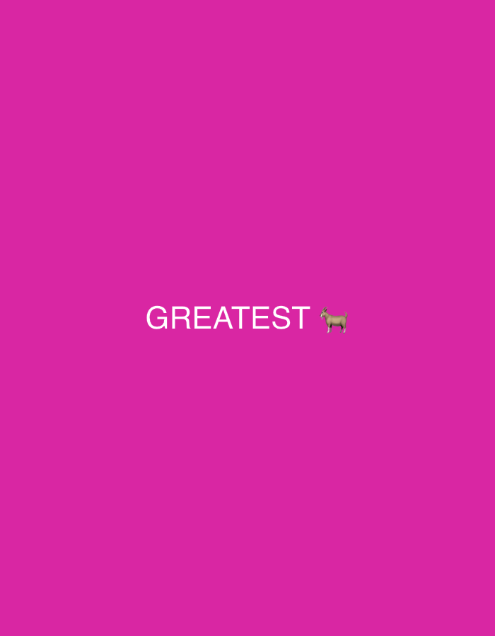 The image is a flat, vibrant pink background with the word "GREATEST" in white sans-serif font centered horizontally and positioned in the lower half of the frame. To the right of the word "GREATEST" is a small, light brown goat emoji. The image does not depict any specific location in Ihiagwa, Nigeria.