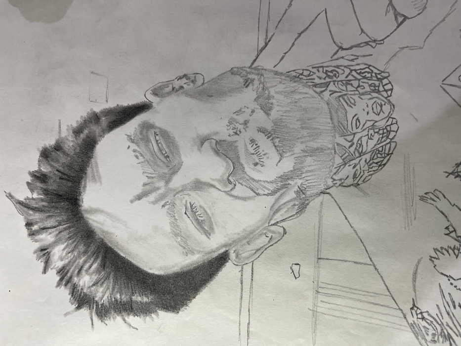 This image is a graphite pencil drawing on white paper, depicting a male individual from the chest up, positioned at an upward and slight left-to-right angle. The subject has dark, spiky hair, a beard, and a mustache. His eyes are partially closed, and his lips are pursed, conveying a determined or intense expression. Extensive tattoos are visible on his neck, featuring multiple stylized faces or figures, and further tattoo patterns, including what appears to be part of a winged design, extend onto his left shoulder/chest area. A partial collar is visible on the right side of his neck, suggesting a shirt or jacket. The background is a plain white, devoid of discernible environmental details or objects, consistent with a portrait study. This depiction is situated within the context of the city of Jos, Nigeria.