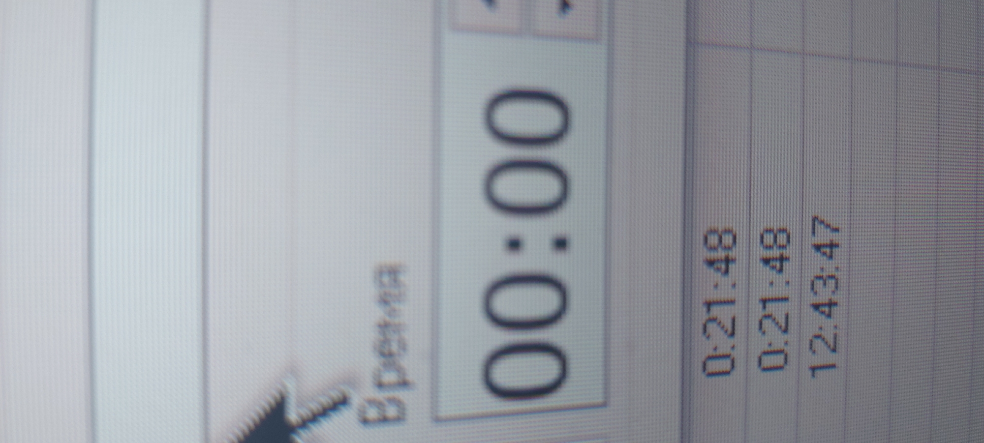The image is a close-up photograph of a computer screen. The screen displays what appears to be a timer set at "00:00", alongside a table with timestamp-like entries, including "0:21:48" and "12:43:47". The timer is labeled "Время", which translates to "Time" in English. The image has a slightly tilted perspective and the screen's pixel structure is visible.
The location, Tashkent, Uzbekistan, is not evident from the visual information in the photograph.