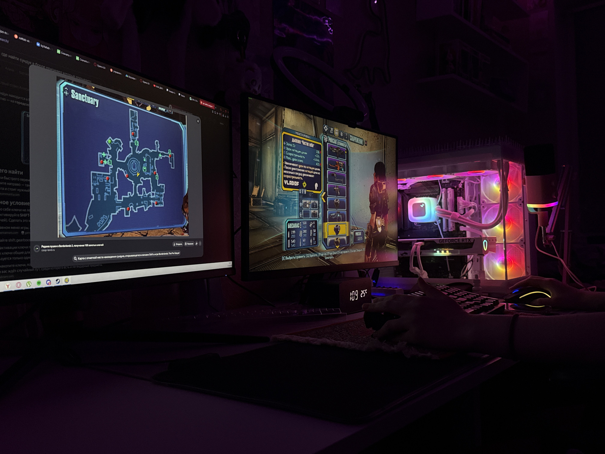 A nighttime indoor scene depicts a gaming setup with two computer monitors, a gaming PC with RGB lighting, and a keyboard and mouse. The left monitor displays a map of a game location labeled "Sanctuary" from Borderlands 2. The right monitor shows a game inventory screen with item stats and graphics, also from Borderlands 2. A person's hands are visible, operating the mouse and keyboard. The computer tower prominently features a "GEFORCE RTX" logo. The environment is dimly lit, with colorful RGB lights from the PC and the monitors contributing to the ambiance. The location is identified as Pudomyagi, Russia.