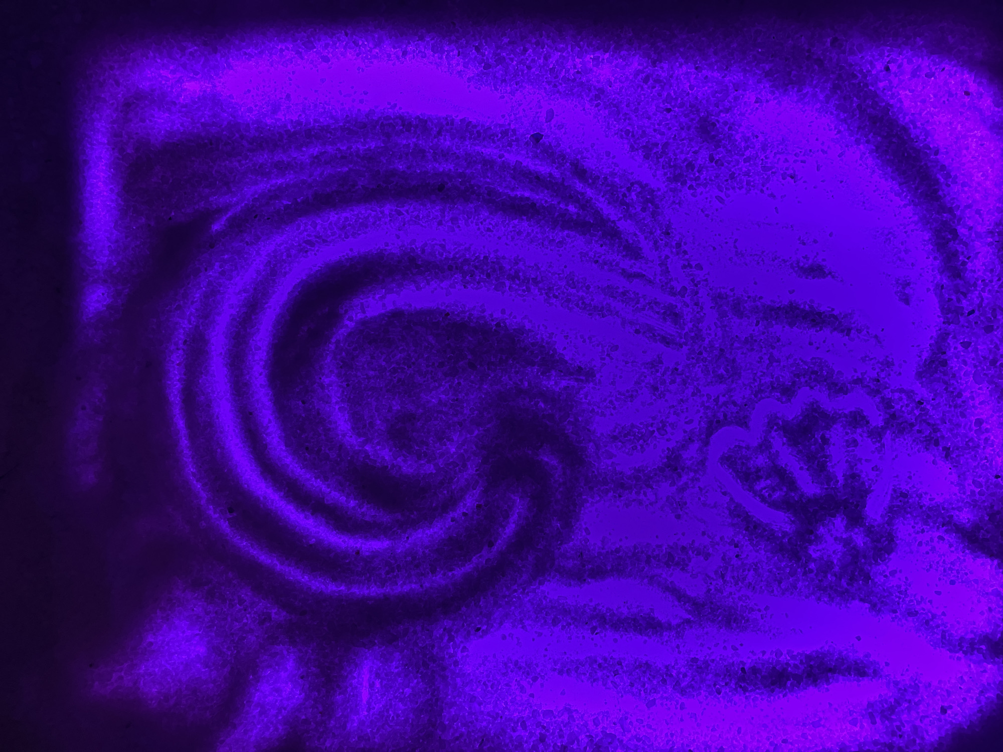A textured purple background features a swirling pattern on the left side and a faint heart shape on the right. The overall appearance suggests an artistic creation rather than a real-world scene. There is no indication of the location being Vinnytsia, Ukraine, or any people, subjects, objects, actions, or interactions within the image.