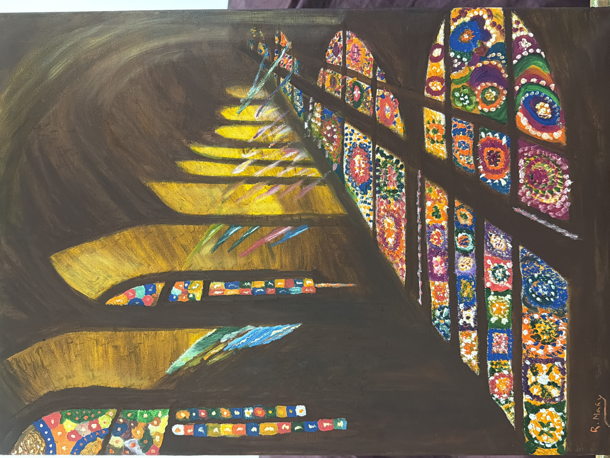 An oil painting depicts the interior of a cathedral or large church, with stained glass windows casting colorful light and patterns onto the floor and walls. The scene is characterized by strong contrasts between light and shadow. Arches are visible in the background, illuminated by golden light streaming through the windows. The floor is covered in a mosaic of colorful light projections, suggesting intricate patterns from the stained glass. The overall mood is one of solemnity and spiritual contemplation, conveyed through the dramatic lighting and the architectural setting. There are no people depicted in the painting. The artist's signature, "R. Marí," is visible in the lower left corner. This artwork does not depict a specific location in Elche.