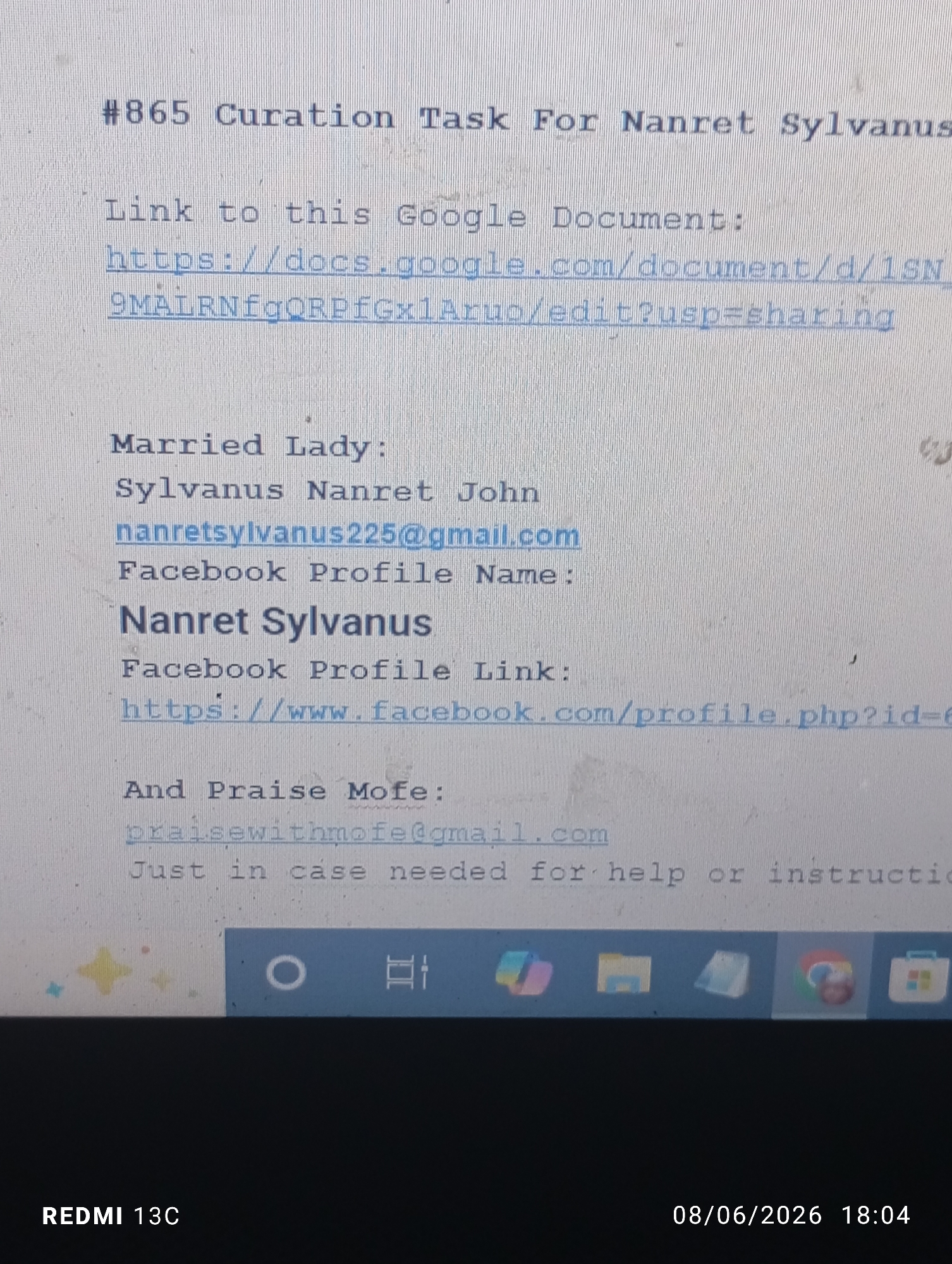 The image shows a computer screen displaying text and icons. The text includes a heading "#865 Curation Task For Nanret Sylvanus", a link to a Google Document, contact information including an email address and a Facebook profile link for "Nanret Sylvanus", and contact information for "Praise Mofe". The lower part of the screen shows a taskbar with various application icons, including Google Chrome. A timestamp "08/06/2026 18:04" and "REDMI 13C" are visible at the bottom. The image does not contain any information about the city of Jos, Nigeria, nor does it depict any people. The scene is a close-up of a digital display.