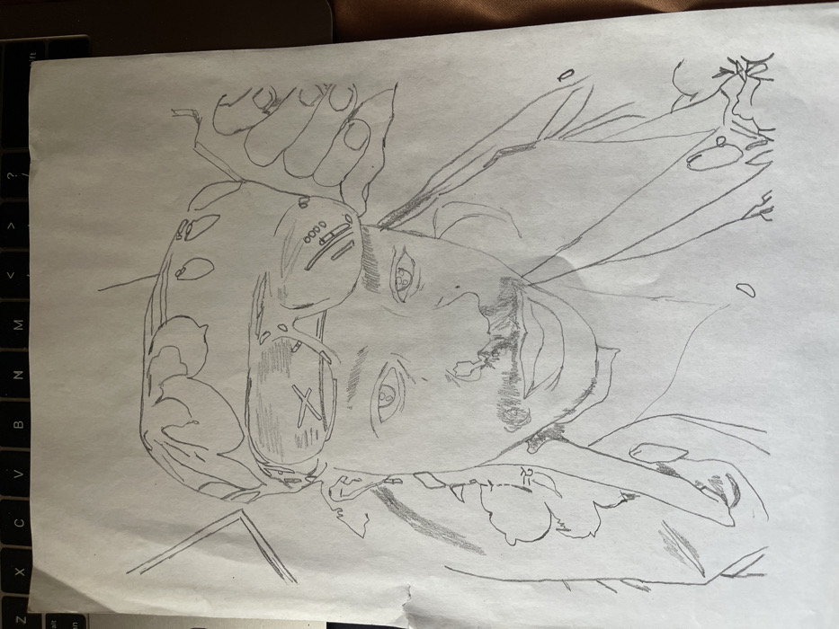 A monochromatic pencil sketch on a piece of white, slightly creased paper, positioned over a laptop keyboard, depicts a head-and-shoulders portrait of an individual. The subject faces forward, wearing a bandana with a floral or leaf pattern and dark sunglasses pushed onto their forehead, reflecting a cross-hatched pattern in the left lens. They possess a neatly trimmed mustache and goatee, and are depicted with dangling earrings and a collared garment. Outlines suggesting hands are visible near the head. The location is Jos, Nigeria.