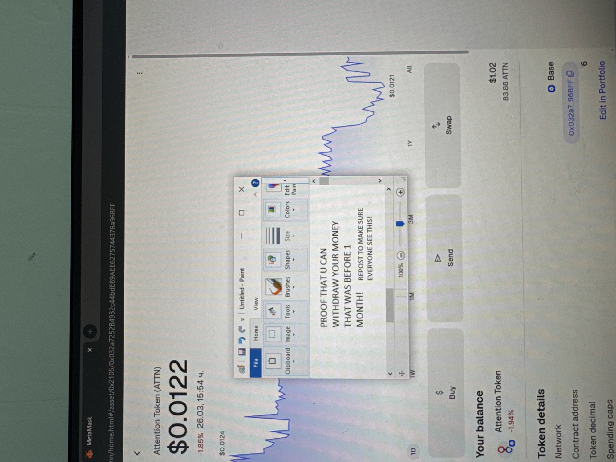 The image displays a close-up photograph of a computer monitor showing a cryptocurrency interface through a web browser, with an overlaid "Untitled - Paint" application window. The specific location in Varna, Bulgaria, cannot be determined from the image content.
The primary application on the monitor is a MetaMask interface detailing "Attention Token (ATTN)." The current price is listed as $0.0122, down -1.85% as of "26.03, 15:54 ч." A blue line graph illustrates price fluctuations over various timeframes, including 1D, 1W, 1M, 3M, 1Y, and All. The interface displays "Buy," "Send," and "Swap" buttons. Below these, "Your balance" shows $1.02, corresponding to 83.88 ATTN, with a -1.94% change for the token. "Token details" indicate the Network as "Base," a partial Contract address "0x032a7_96BFF," and a Token decimal of 6. An "Edit in Portfolio" option is visible.
Overlaying this interface is a standard Windows "Untitled - Paint" application window. The "Home" tab is selected, displaying tool icons for Clipboard, Image, Tools, Brushes, Shapes, Size, Colors, and Edit Paint. Within the Paint window, black text on a white background reads: "PROOF THAT U CAN WITHDRAW YOUR MONEY THAT WAS BEFORE 1 MONTH! REPOST TO MAKE SURE EVERYONE SEE THIS!" The zoom level is set to 100%.
The monitor screen itself exhibits minor dust particles and smudges. A light source is reflected in the upper left portion of the screen. The background wall visible above the monitor is a solid light green or teal color. No individuals are present in the image.
