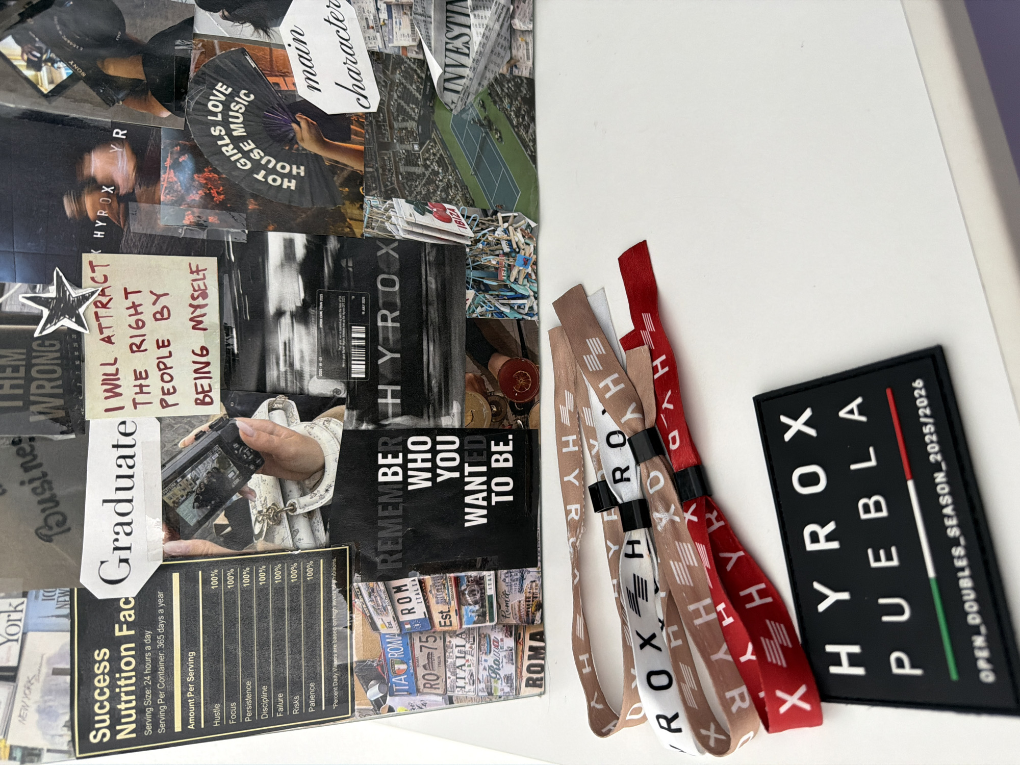 The image shows a collage with motivational phrases and images related to success, with a "Hyrox" theme. The collage is placed next to a white surface with several Hyrox wristbands in brown, white and red colors. Next to the wristbands, there is a black rectangular patch with the words "HYROX PUEBLA OPEN_DOUBLES_SEASON_2025/2026," indicating the location in Puebla, Mexico.