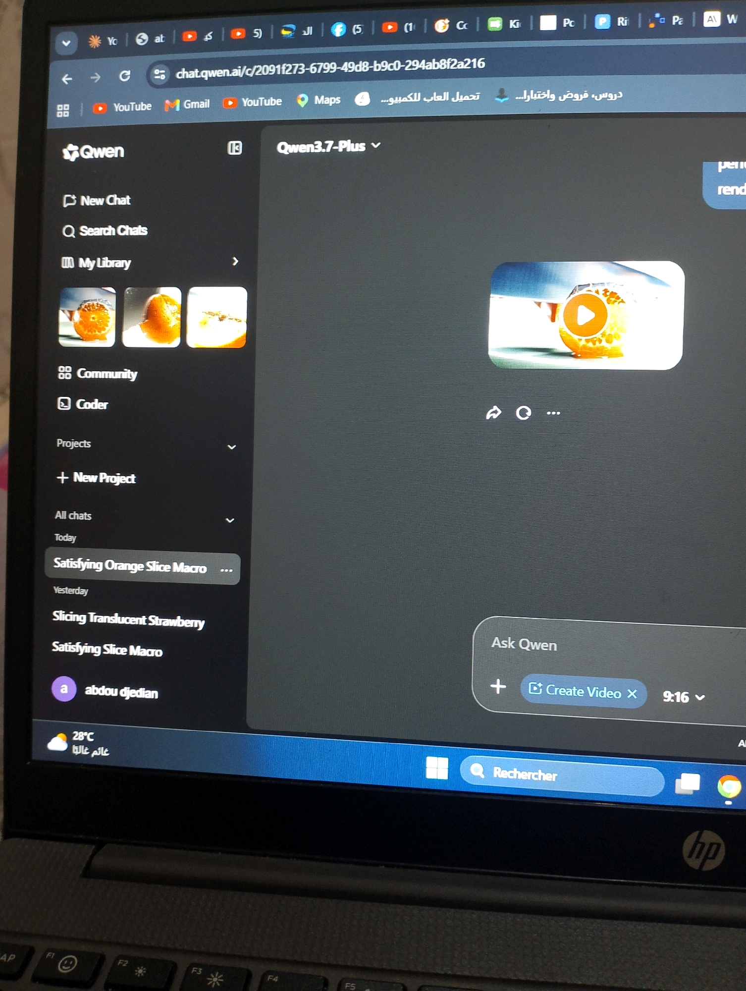 The image shows a laptop screen displaying the Qwen.ai website. The website features a sidebar on the left with options such as "New Chat," "Search Chats," and "My Library." Below these options are previews of recent chats, including "Satisfying Orange Slice Macro" and "Slicing Translucent Strawberry." The main content area of the screen shows a video with a play button overlaid on an image of an orange. Below the video, there is a chat interface with the prompt "Ask Qwen" and a button that says "Create Video." At the bottom of the screen, there is a search bar with the word "Rechercher" (French for "Search") displayed. The laptop itself is an HP model. The image is taken from an angle, indicating it's a photograph of the screen. The presence of "Bordj Menaiel, Algeria" in the prompt suggests this scene is likely located in or related to that city.