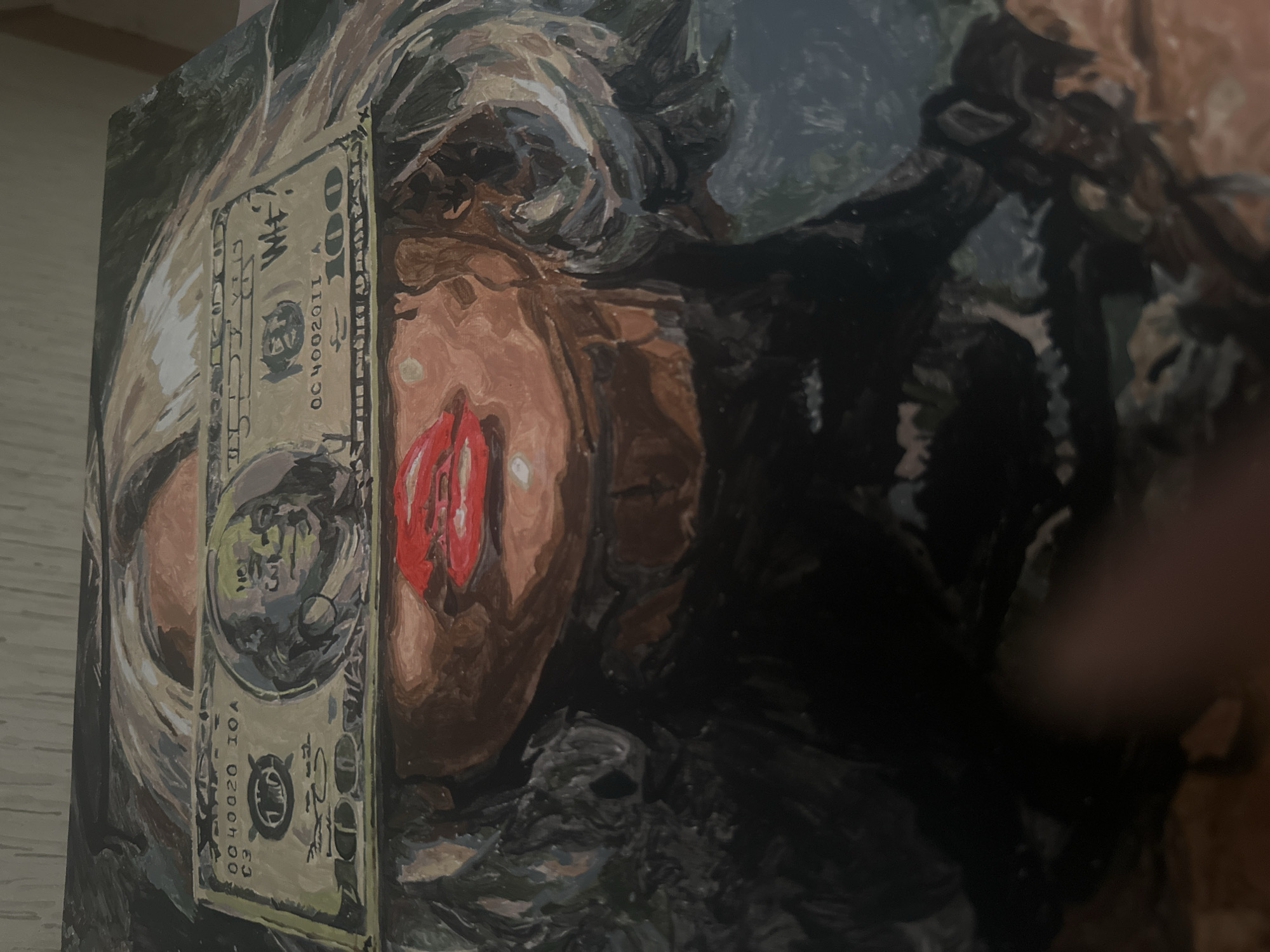 A painting depicts a woman with blond hair and red lips. A painted image of a $100 bill is superimposed over her face. The painting is resting on a surface that looks like light-colored wood. It is not possible to determine the location of Высокий, Russia from the image.