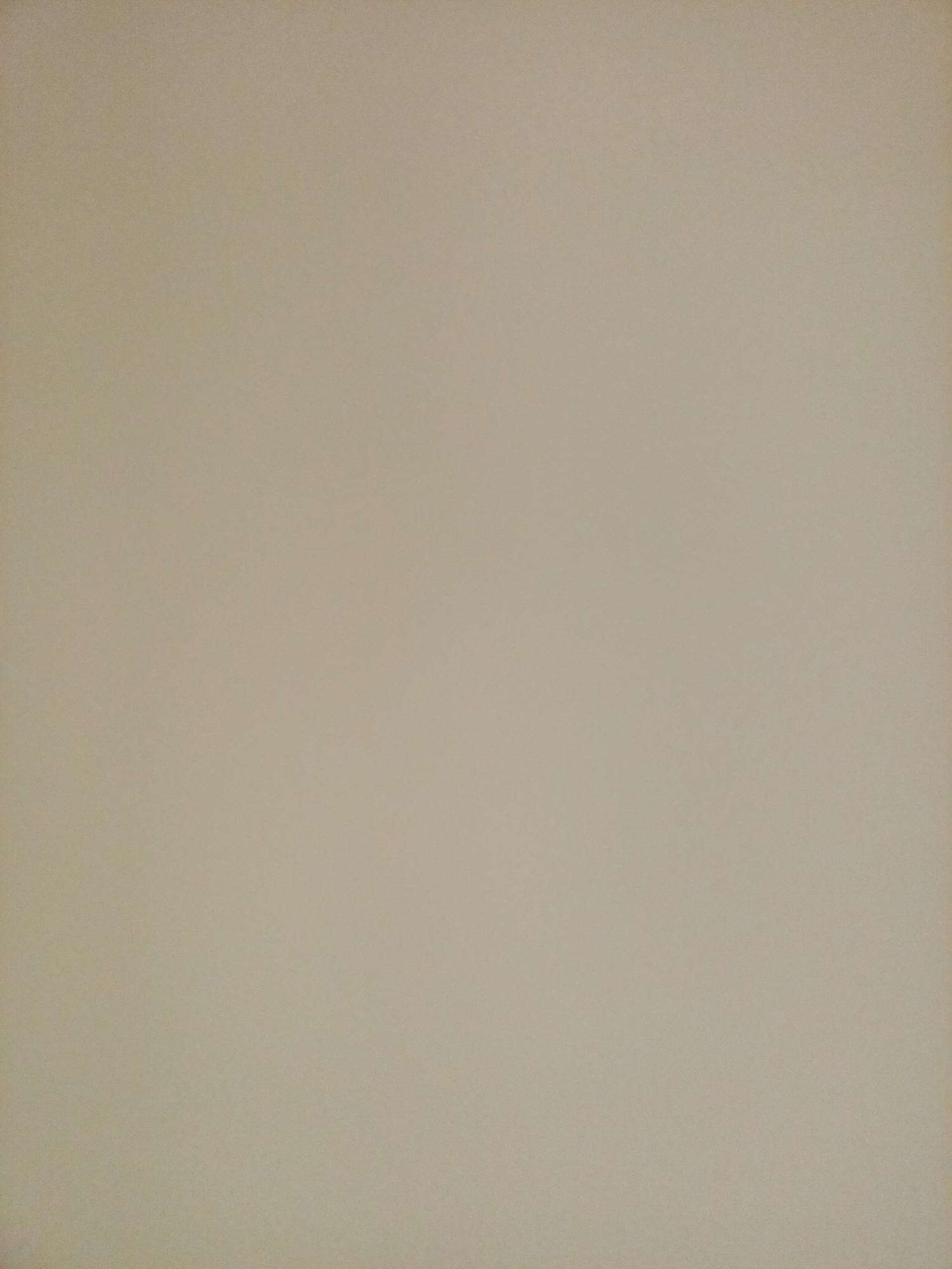 The image is a plain, evenly lit photograph of a beige surface, possibly a wall or fabric. There are no discernible objects, people, or actions present. The photograph lacks any specific context or detail that would allow for identification of a location in Rostov-on-Don, Russia, or any other place. The surface appears to be a uniform color with subtle variations in shading due to lighting.