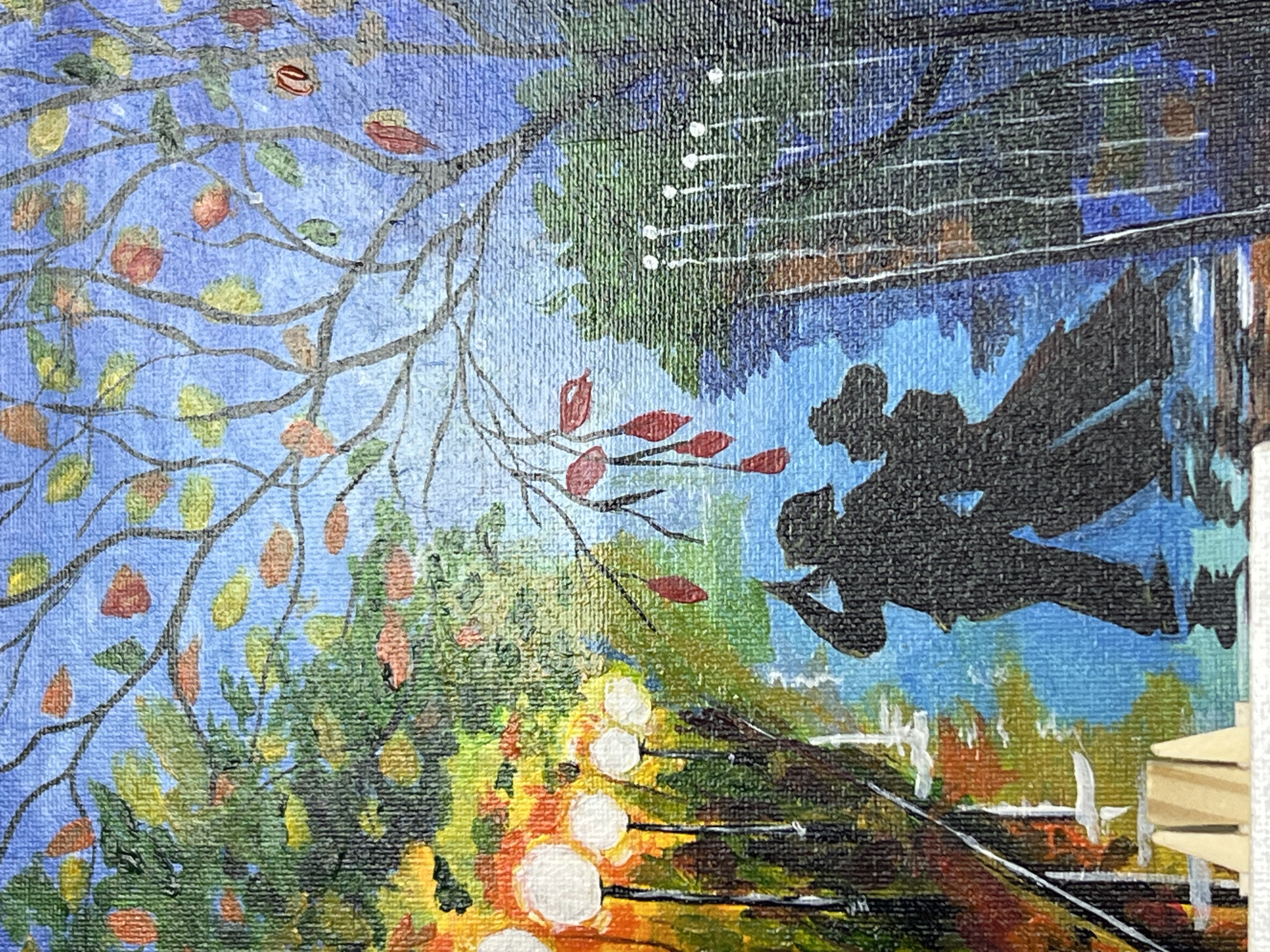The image depicts a portion of a canvas painting, likely acrylic, split into two distinct scenes. On the left, a tree with sparse leaves in autumnal colors (yellow, orange, and red) branches against a blue sky, with denser foliage below. On the right, a black silhouette suggestive of people is superimposed over a streetscape with buildings, possibly reflected in water. The buildings are painted with greens, blues, and hints of orange. Below the buildings are trees and fence posts, and in the foreground are lights. The upper portion of the right side includes lines of light. The image has a painted texture with a canvas background. The location is Chaikovsky, Russia.