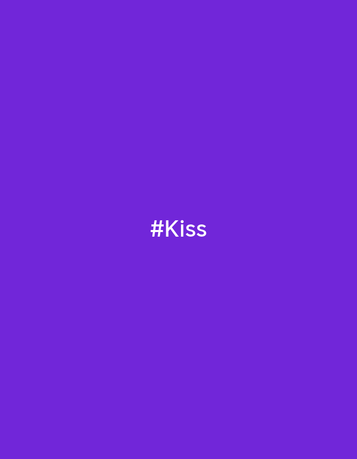 The image is a purple background with the white text "#Kiss" centered in the frame. There are no people, subjects, objects, actions, interactions, or environment depicted beyond the text and background color. There is no information about Noviy, Russia.
