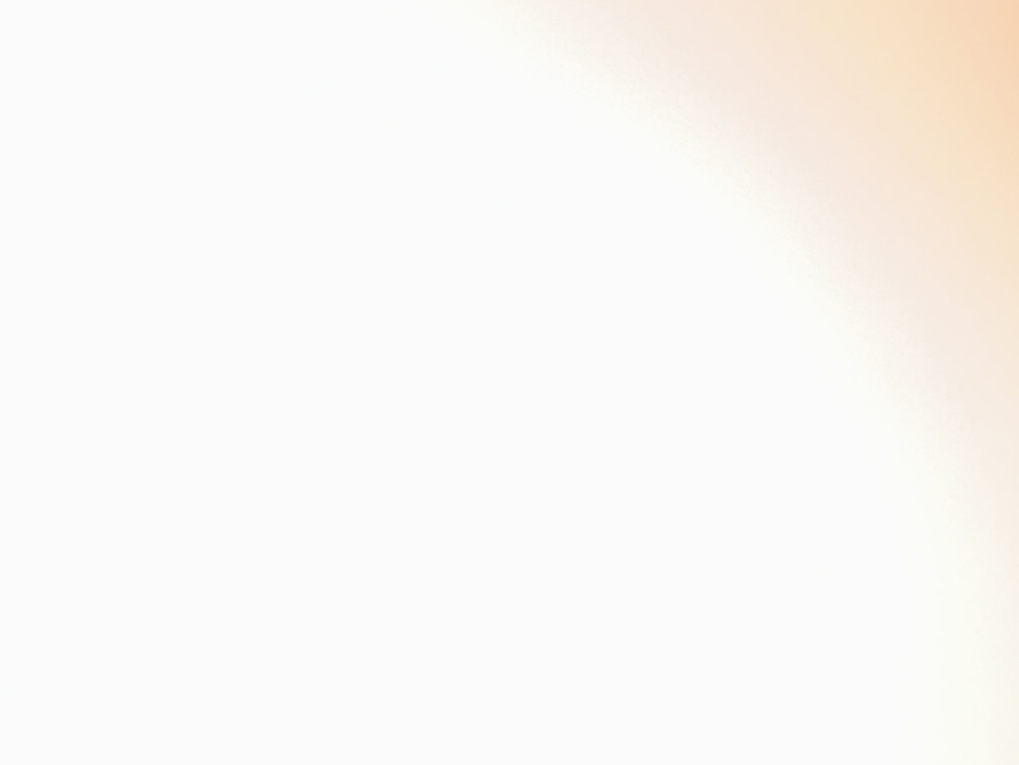 The image displays a predominantly white field with a subtle, light peach-colored gradient emanating from the lower right corner and extending diagonally into the central-lower and right portions of the frame. The upper and left regions of the image remain a uniform white. No discernible people, subjects, objects, actions, or specific environmental features are present. No identifiable location within the city of Foggia, Italy, or any other geographical area, can be determined from the visual content. The scene consists solely of this abstract color composition.