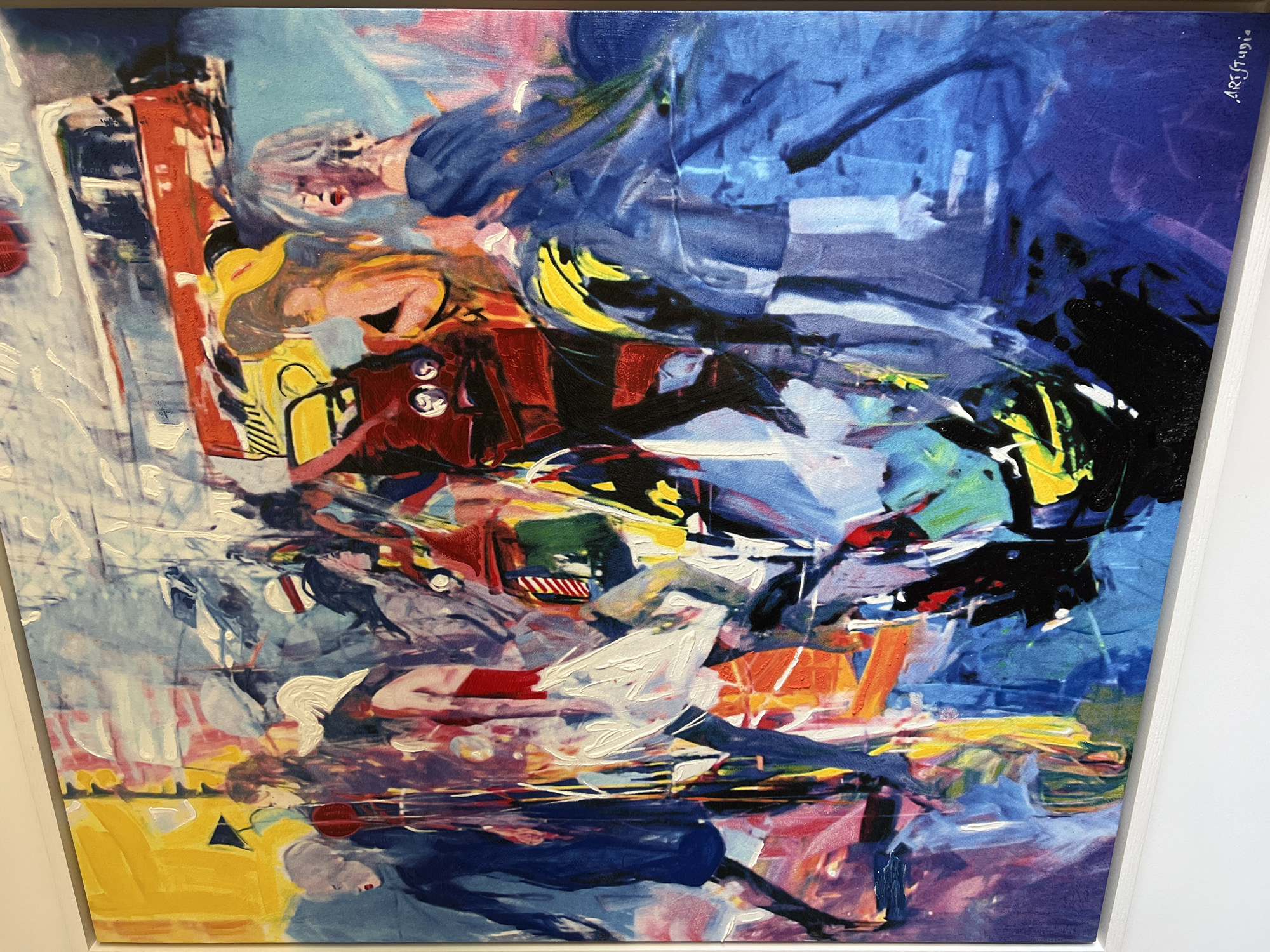 This is an abstract, expressionistic painting characterized by a vibrant and dynamic composition. The artwork features multiple fragmented and stylized human figures interwoven with abstract shapes that suggest elements of an urban environment or machinery.
The color palette is dominated by bold blues, reds, and yellows, with significant use of black, white, and various other hues. The paint is applied with energetic, gestural brushstrokes and thick impasto, creating a textured surface that emphasizes movement and form.
Several human figures are discernible within the chaotic arrangement. In the upper left, a figure with light-colored hair and a red mouth appears to be falling or in motion, wearing a blue garment. Below this, another figure with blonde hair and a yellow top is visible. Towards the bottom left, a figure lies down, partially obscured by yellow and blue shapes. Another figure, possibly nude or lightly clothed, appears in the mid-right, with prominent red elements. The figures often have open mouths, contributing to a sense of urgency or distress.
The overall scene conveys intense movement and a sense of collision or compression. The overlapping forms and lack of clear narrative create an impression of rapid, fragmented action, evoking feelings of excitement, stress, or chaos. The painting does not depict a specific time of day or weather. In the upper right corner, the text "ART.Studio." is vertically inscribed, likely indicating the artist or studio.