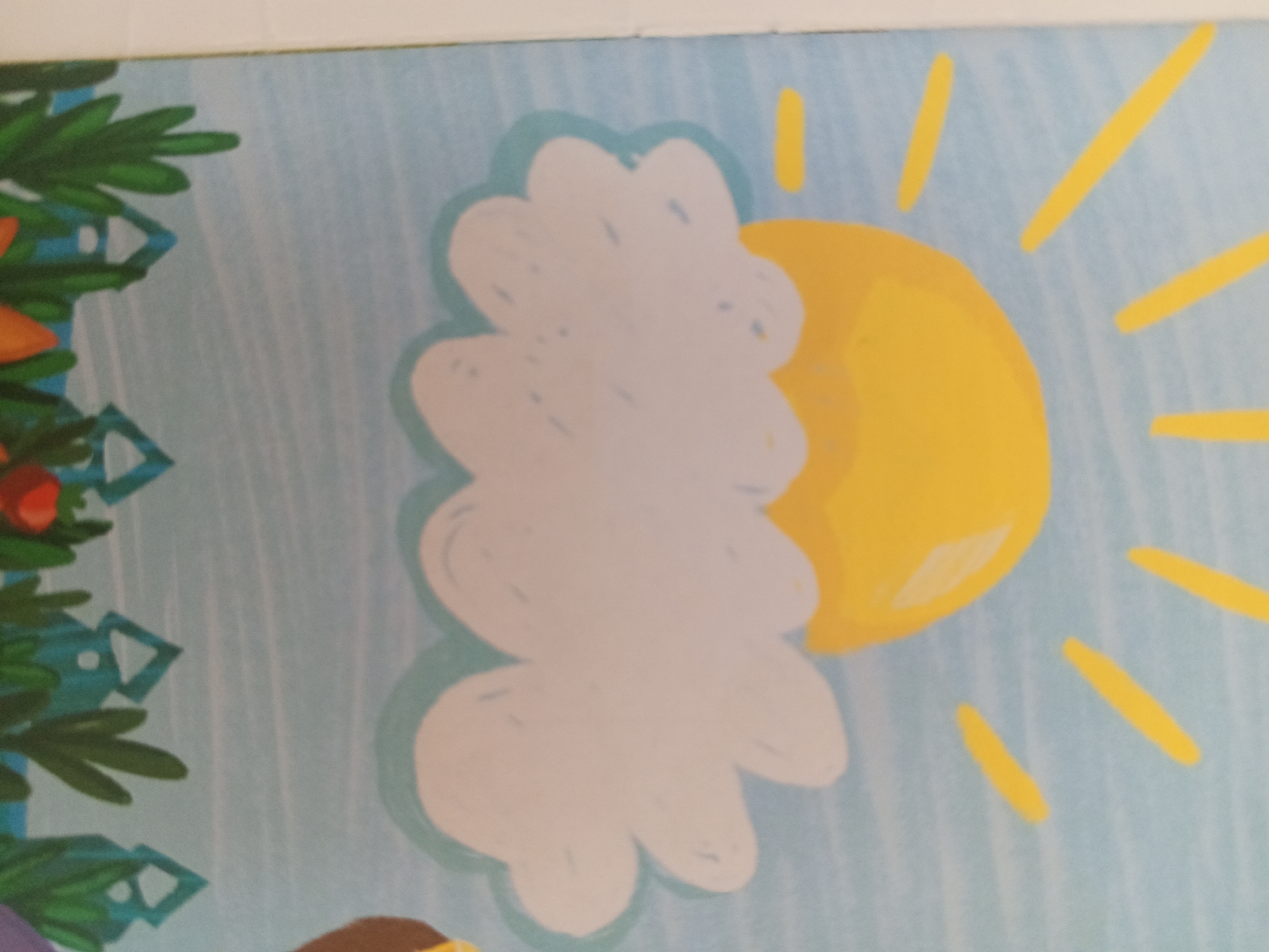 The image is a close-up of a children's book illustration. It depicts a stylized sun with radiating yellow lines against a light blue, striped background. In the foreground, a large, fluffy white cloud with a light blue outline is positioned to the left of the sun. To the far left of the image, part of a green, stylized Christmas tree with blue geometric ornaments is visible. The scene is a simplified, cheerful depiction of a sunny day, possibly for young children. The image does not contain any information that would allow for its location to be determined within the city of Chistopol, Russia.