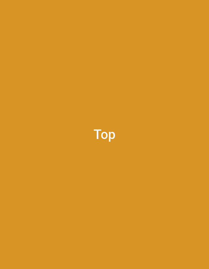 The image is a solid amber background with the word "Top" in white in the center. There is no indication of location or any elements that would suggest London, United Kingdom, or any city. There are no people, subjects, objects, actions, or interactions depicted.