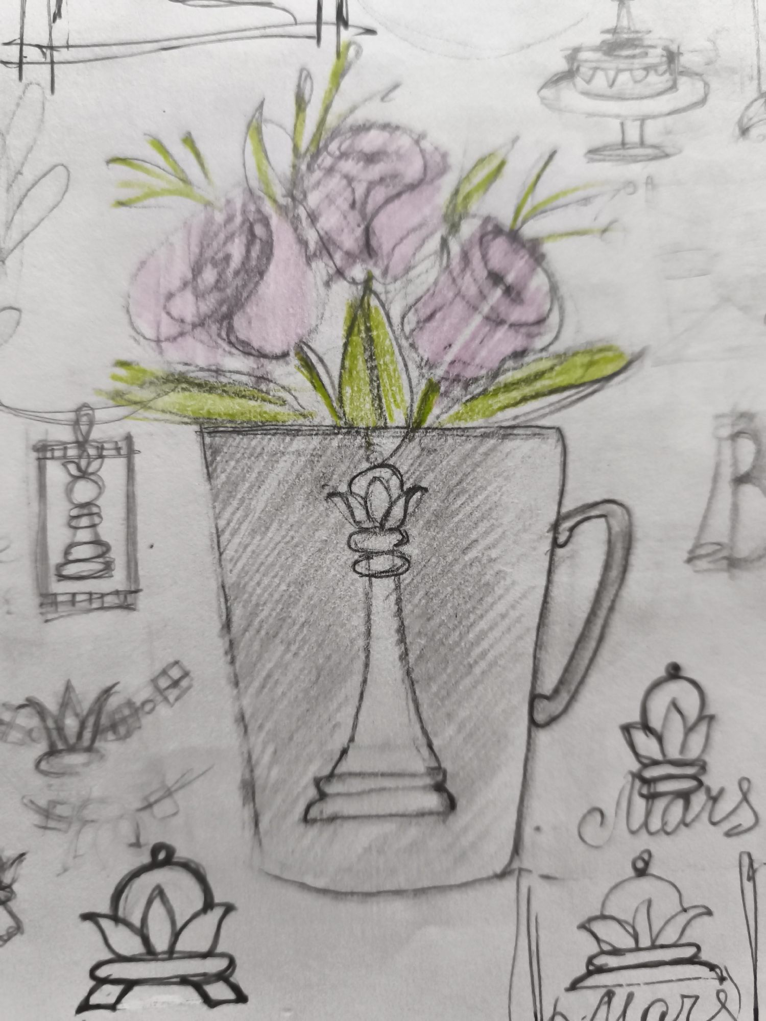 The image is a pencil sketch on paper. The central subject is a mug containing a bouquet of pink flowers with green stems and leaves. The mug itself is depicted in pencil shading, with a handle visible on the right side. Within the mug, a chess piece, specifically a bishop, is drawn in outline.
Scattered around the central subject are other sketched elements, including what appears to be a cake on a tiered stand at the top right, a small rectangular object with a drawing resembling a chess piece inside on the left, and decorative motifs that resemble stylized flowers or crowns, some with the word "Mars" written below them. The background is a rough sketch, suggesting a sketchbook or artistic study.
The image does not contain any information that would allow for the determination of its location in the city of Saint-Denis, France, nor does it depict any people, actions, or interactions. It is a still life composition.