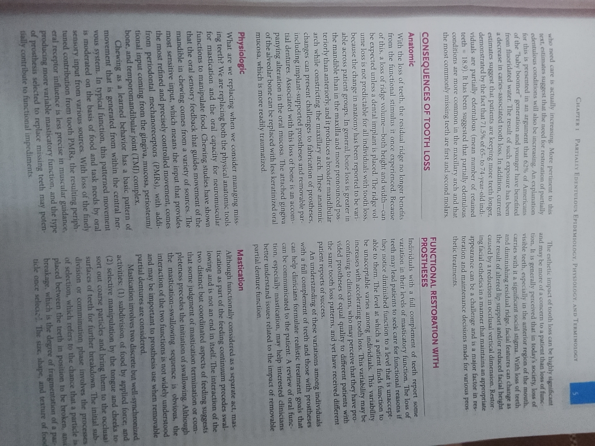 The image is a close-up, overhead shot of a page from a textbook. The page is filled with text, organized into several paragraphs and headings. The text appears to be in English, and discusses topics related to dentistry and prosthetics. There are no other objects or individuals visible in the image. The lighting appears to be even, and the focus is sharp on the text. There is no indication of a specific city or location, as the image is of a printed document.
