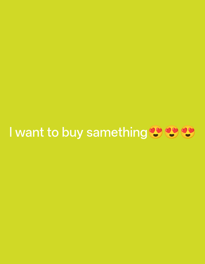 The image displays white text on a bright yellow background. The text reads "i want to buy samething" followed by three heart-eyed emoji faces. There are no people, objects, or discernible environmental features to describe. The location in Payagaboh, Indonesia is not depicted or suggested by the image content.