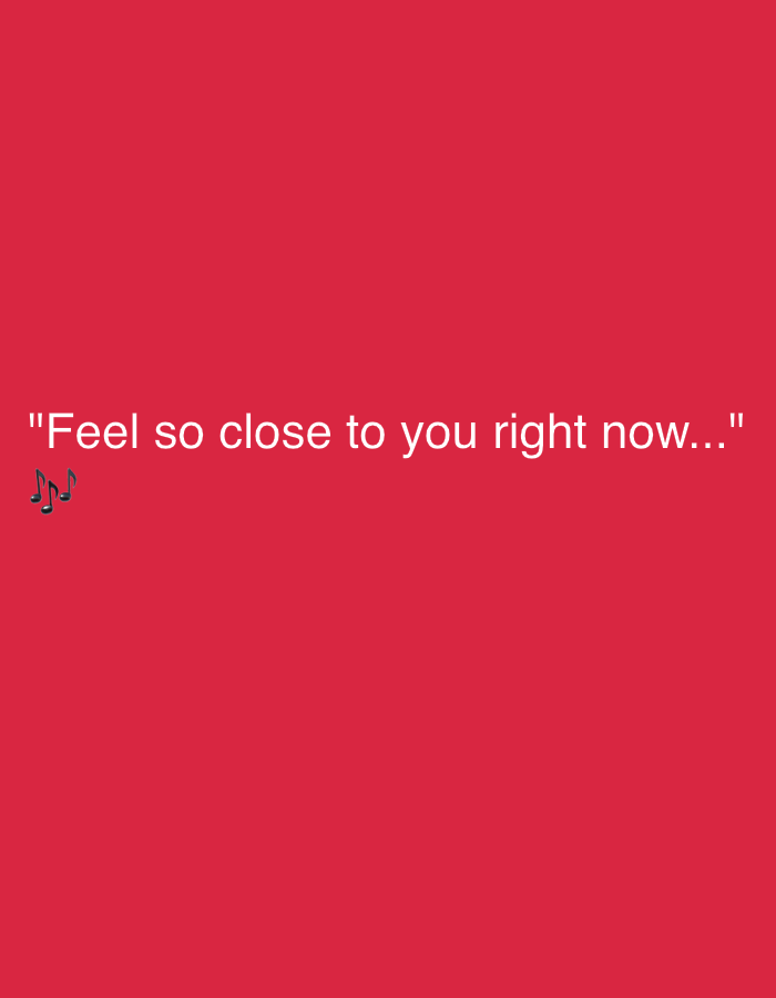 The image is a digital graphic with a plain red background. White text reads, "Feel so close to you right now..." There are three black musical notes in the bottom left corner of the image, below the text. The image does not contain any elements that would allow for its location to be determined in the city of Maracay, Venezuela.