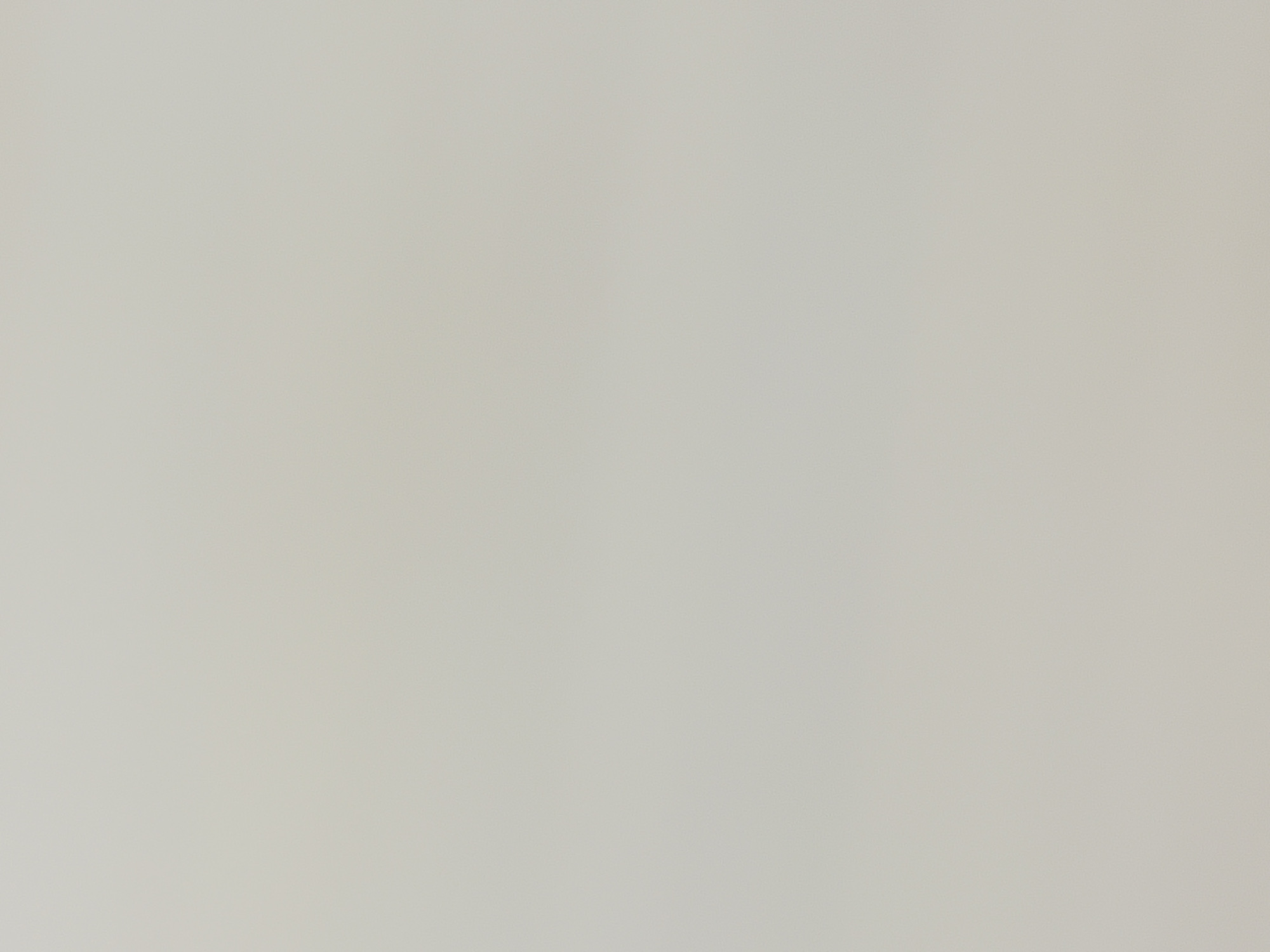 The image is a plain, light beige background, lacking any discernible subjects, objects, actions, or environmental details. There is no visual information present to indicate its location in Casablanca, Morocco, or any other city.
