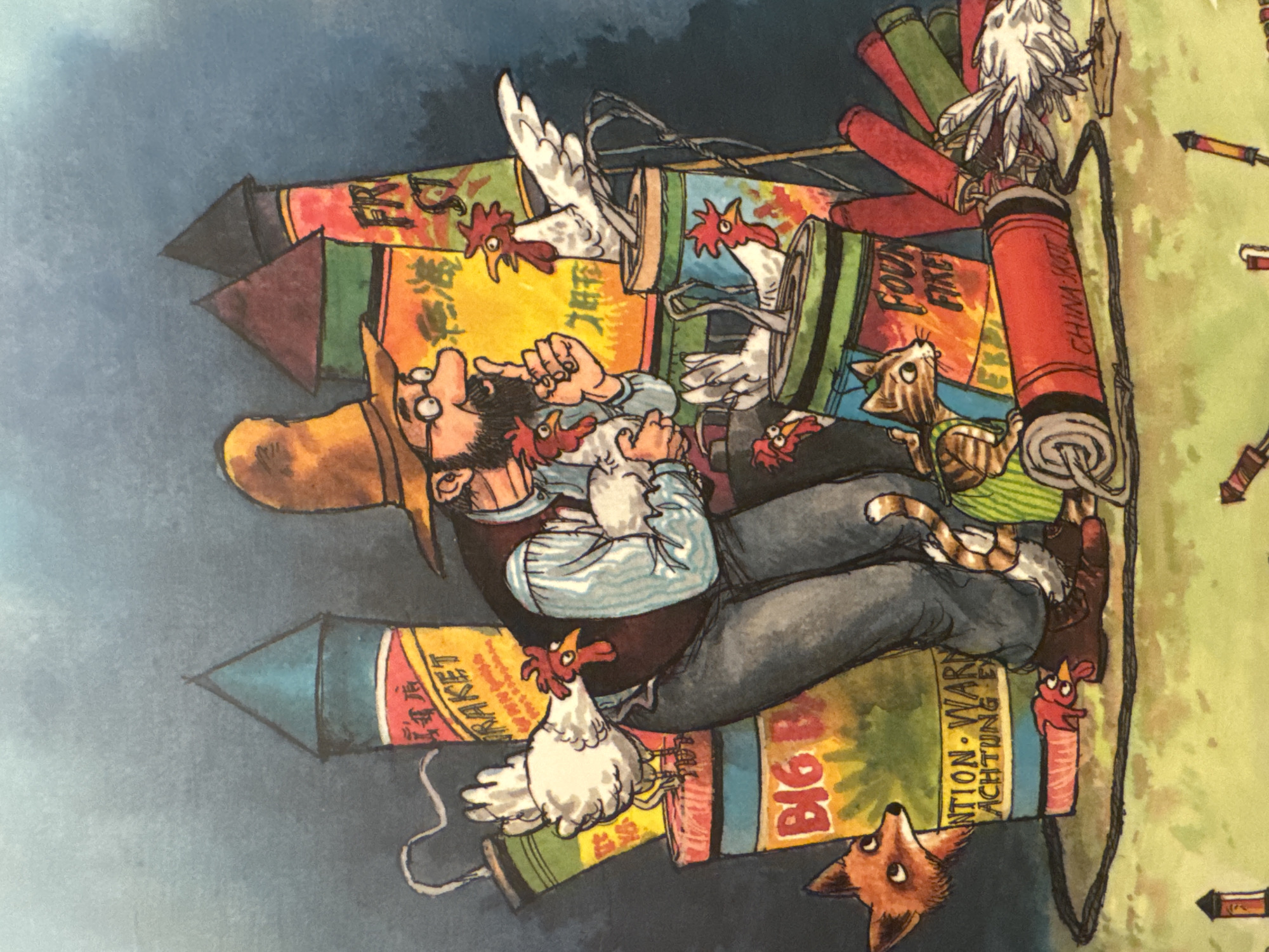 The illustration depicts a whimsical outdoor scene with a man dressed in a brown hat and vest, surrounded by an assortment of fireworks and chickens. He is gesturing with his right hand while holding a chicken in his left arm. Several chickens are perched on or near large cylindrical fireworks. A fox peeks from behind a firework labeled "BIG B" with German text. A cat wearing a green striped outfit is also present, sitting next to a firework. Scattered on the ground are more fireworks, including one labeled "CHINA KOTT." The background is a gradient of dark blue to lighter blue, suggesting an evening or night setting. The overall impression is one of playful chaos and a somewhat precarious arrangement of pyrotechnics and fowl.