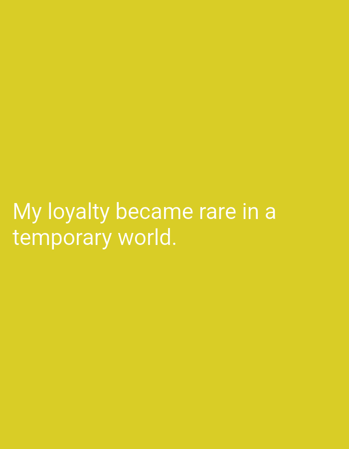 The image shows text on a yellow background. The text reads "My loyalty became rare in a temporary world." There is no discernible location in Mansehra, Pakistan, or any people or objects.