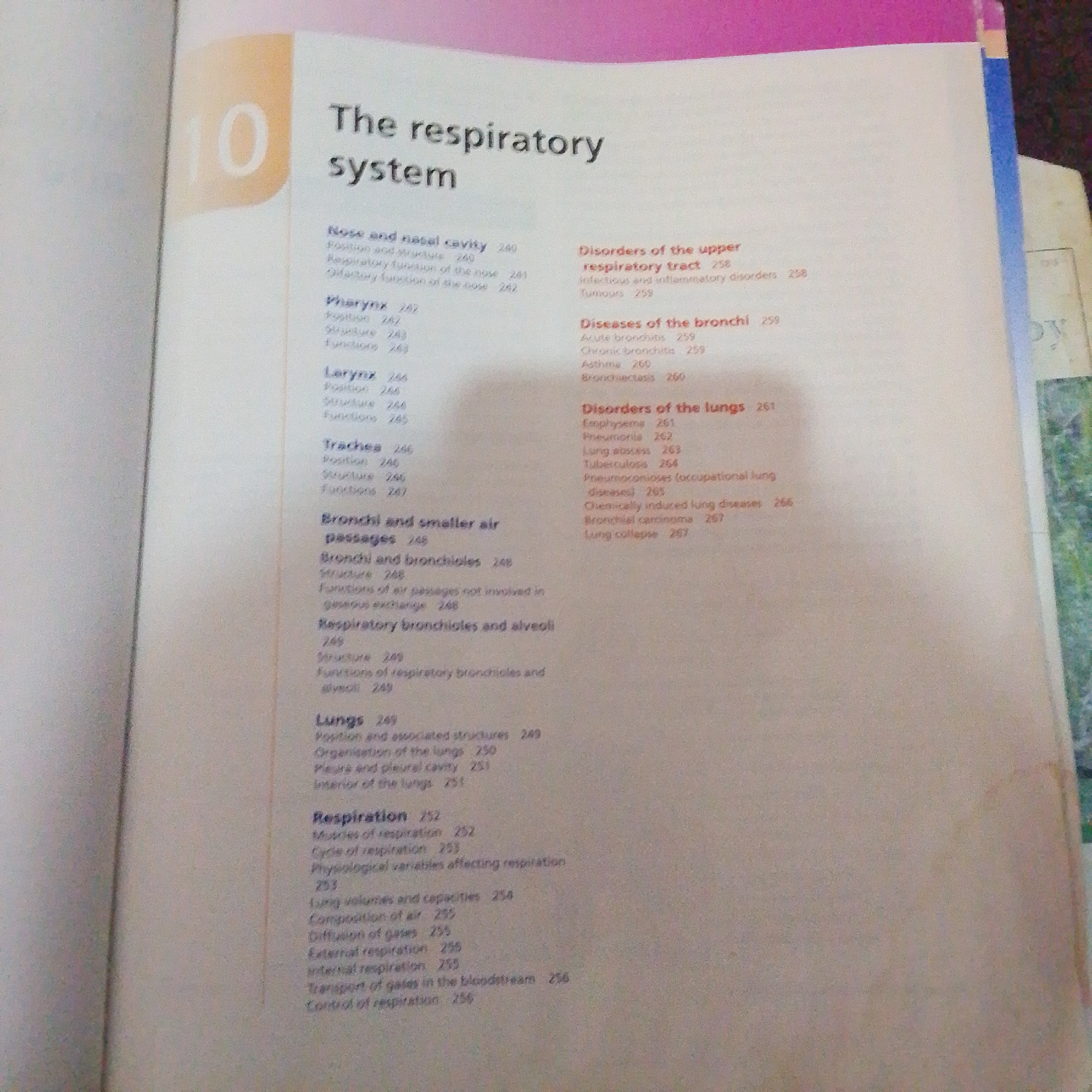 The image displays a book open to a page with a table of contents for a chapter titled "The respiratory system". The chapter number "10" is prominently displayed on the left side of the page. The table of contents lists various subtopics related to the respiratory system, such as "Nose and nasal cavity," "Pharynx," "Larynx," "Trachea," "Bronchi and smaller air passages," "Respiratory bronchioles and alveoli," and "Lungs." It also includes a section on "Disorders of the upper respiratory tract," "Diseases of the bronchi," and "Disorders of the lungs." Specific disorders mentioned include pneumonia, tuberculosis, asthma, and bronchitis. The page also details aspects of "Respiration" such as muscles, cycle, physiological variables, lung volumes and capacities, diffusion of gases, external and internal respiration, and control of respiration. The page is in English, and the text is clearly legible. There are no people visible in the image, and no elements suggesting a location in Jalingo, Nigeria.