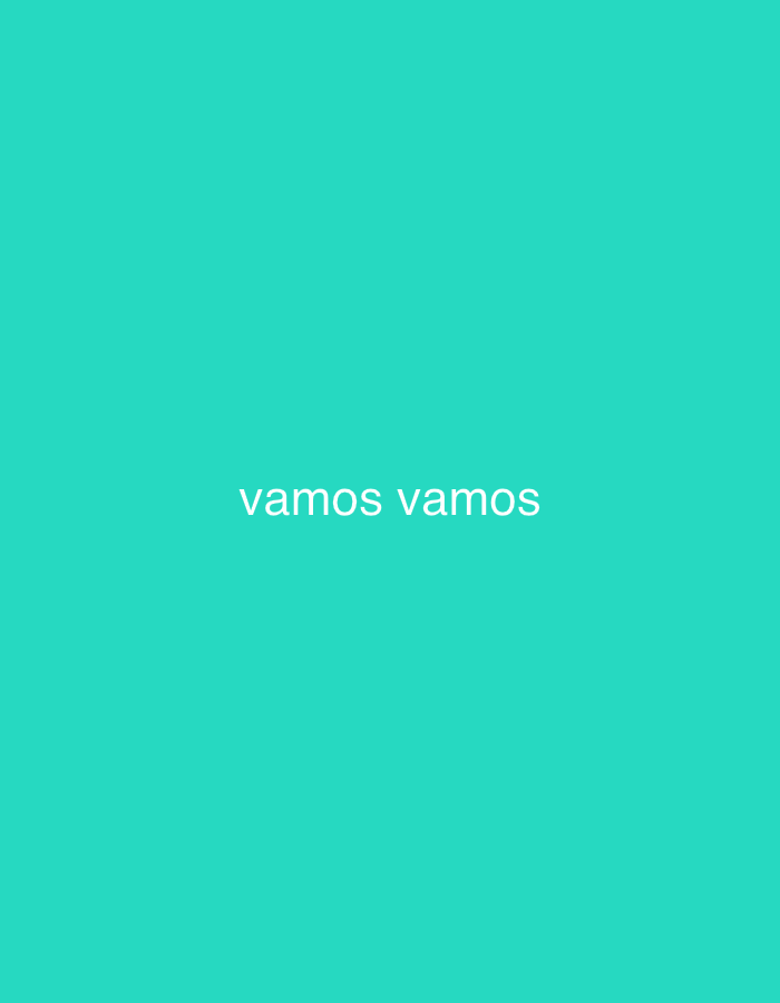 The image displays a simple, solid bright teal-turquoise background. Centered horizontally on this background, the phrase "vamos vamos" is written in white, lowercase sans-serif text. There are no other visible subjects, objects, or discernible scene elements. No activity or event is depicted. The image lacks any specific location cues, weather indicators, or time of day. The phrase "vamos vamos" is Spanish for "let's go" or "come on." While the location context of Santa Ana, Venezuela, is provided, the image itself offers no visual information to corroborate this.