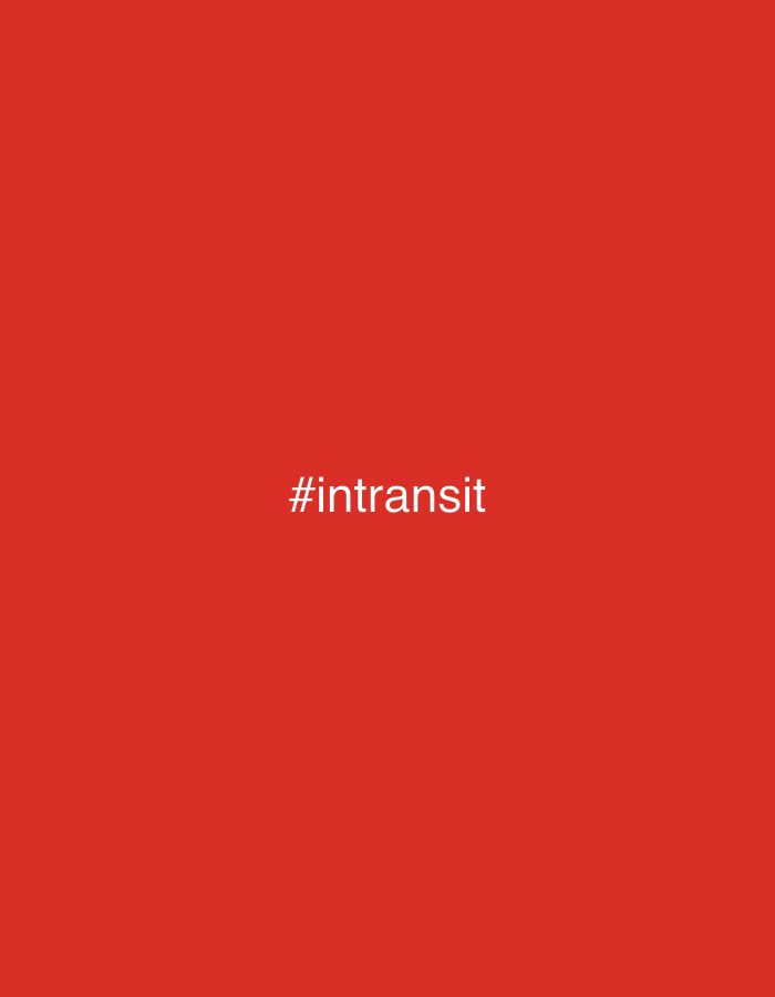 The image is a solid red background with the white text "#intransit" in the center. There is no indication of location, people, subjects, objects, actions, interactions, or specific environment.