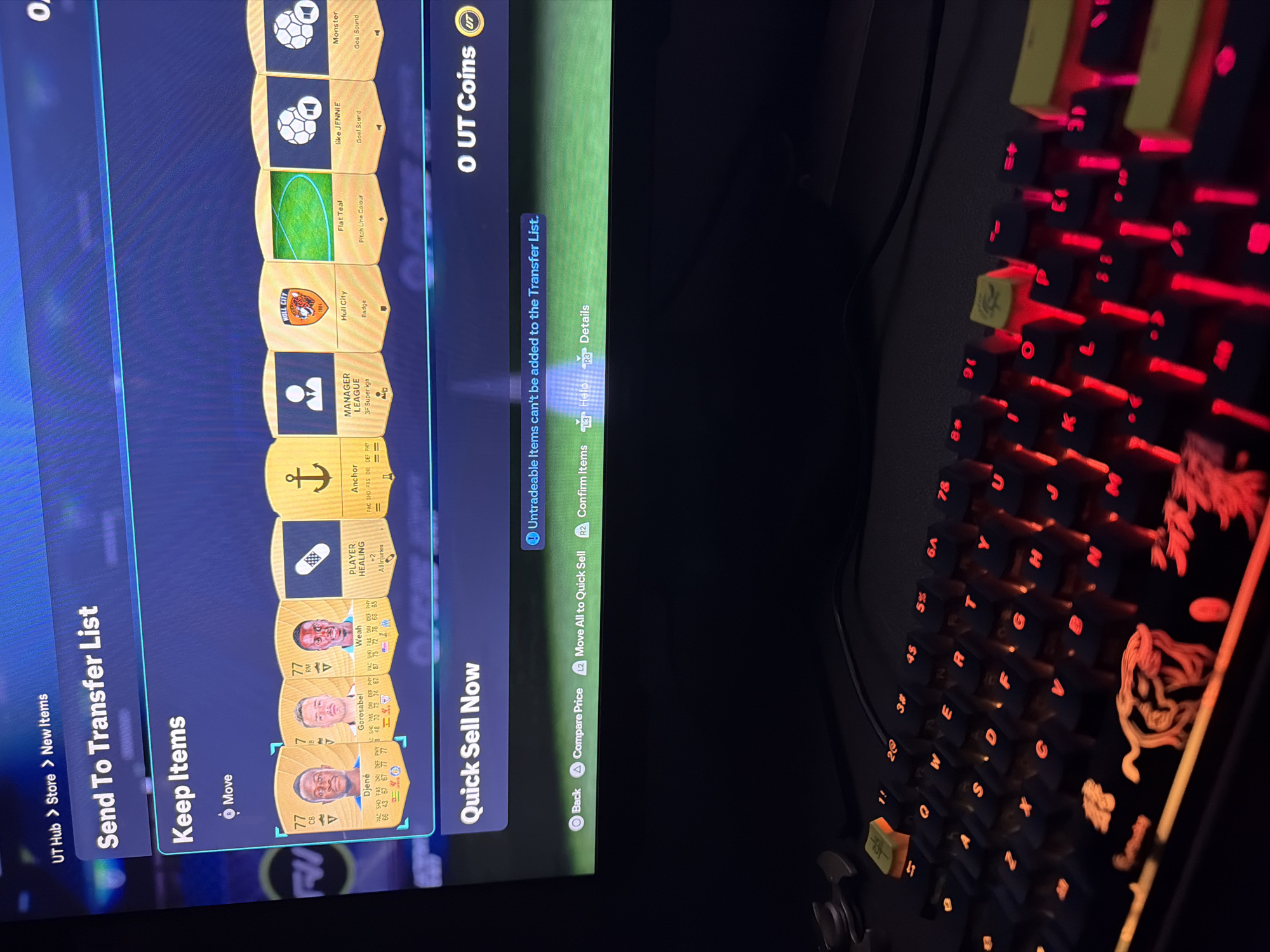 The image shows a screen displaying the "Send To Transfer List" menu in the FIFA Ultimate Team (UT) game. Several items are listed, including player cards (Djené, Gorosabel, Weah), a player healing card, manager league card, Hull City badge, Flat Teal pitch line color, "like JENNIE" goal sound, and "Monster" goal sound. A message indicates that "Untradeable Items can't be added to the Transfer List." The game interface also displays "0 UT Coins." A keyboard with red backlit keys is partially visible to the right of the screen. There is no indication in the image that this is related to Pirgovo, Bulgaria.