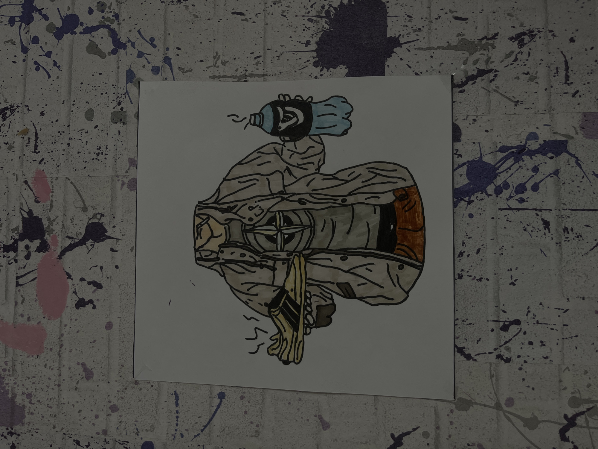 A drawing of a figure composed of various objects is affixed to a wall. The background wall is light-colored with splatters of various colors including shades of blue, purple, and pink. The figure in the drawing has a water bottle for a head, and is holding what looks like a sandal. The figure appears to be wearing some kind of jacket with a logo that has a compass-like design on it. There is a brown cylindrical object on one side of the figure. There is no evidence of the location being in the city of Maladzyechna, Belarus.