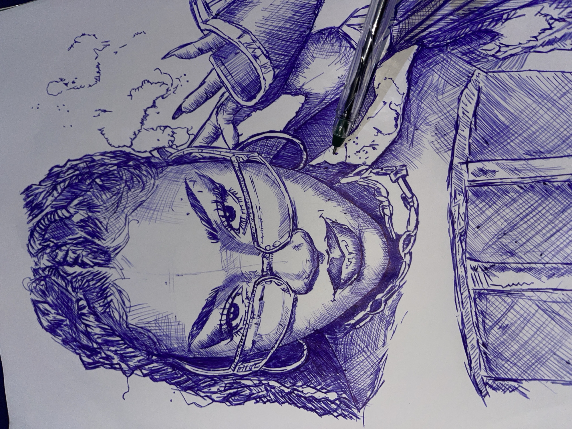 A close-up, eye-level, ballpoint pen drawing on white paper depicts a young woman with braided hair. She is wearing large, rectangular-framed glasses and has hoop earrings. Her left hand is raised, adjusting her glasses. She is smiling slightly, revealing her teeth. She is also wearing a necklace and appears to be wearing an outfit with a textured, structured bodice. The background is mostly white with some scribbled, cloud-like shapes and a few scattered dots. The lower portion of the drawing shows what appears to be the top of a structured garment or furniture. A silver pen with a green tip is positioned on the right side of the drawing, partially obscuring the subject's shoulder. The drawing style is detailed, with cross-hatching used to create shading and form. There is no indication of the city of Jos, Nigeria, or any urban environment within the image.