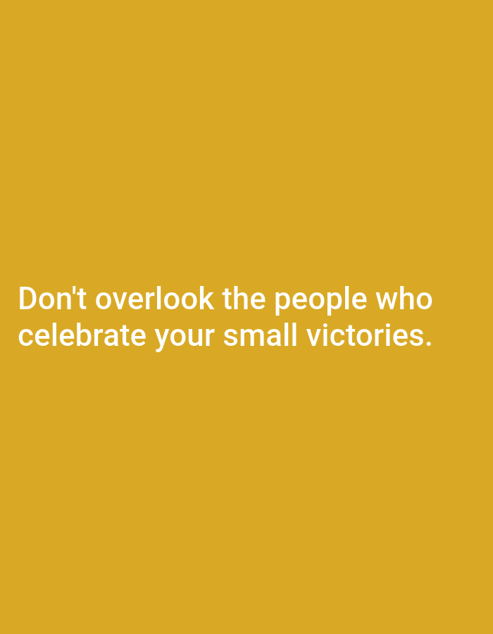 The image is a photograph of a yellow background with white text. The text reads: "Don't overlook the people who celebrate your small victories." There are no people, subjects, objects, actions, interactions, or environmental details visible in the image. The location in Tebuwung, Indonesia, is not discernible from the visual information provided.