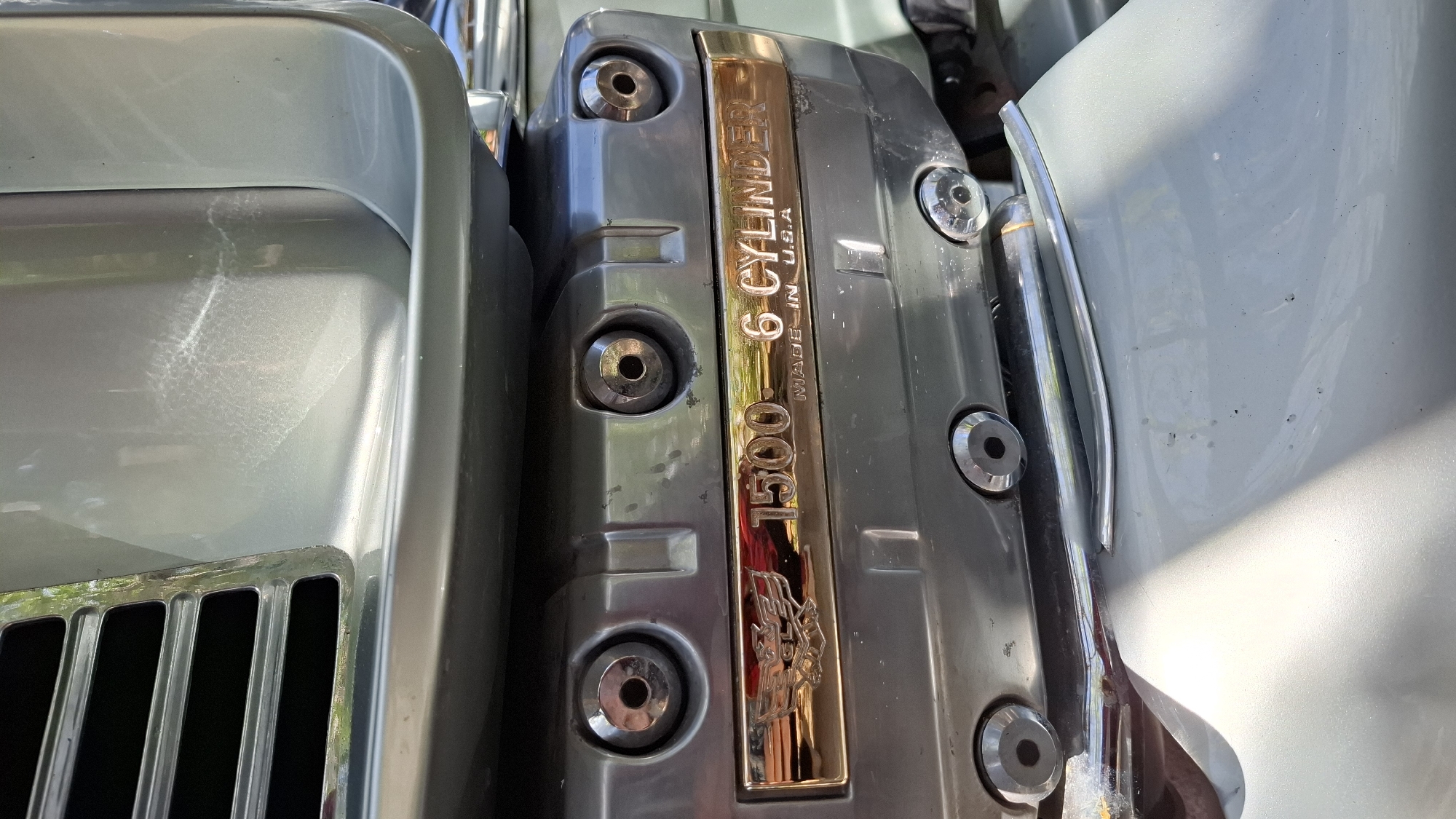 The image shows a close-up of a 1500cc 6-cylinder motorcycle engine, labeled "Made in U.S.A." It is likely located in Budva, Montenegro, but the image alone provides no direct geographical or environmental context to confirm the exact location. There are no people visible, only parts of the vehicle and engine.