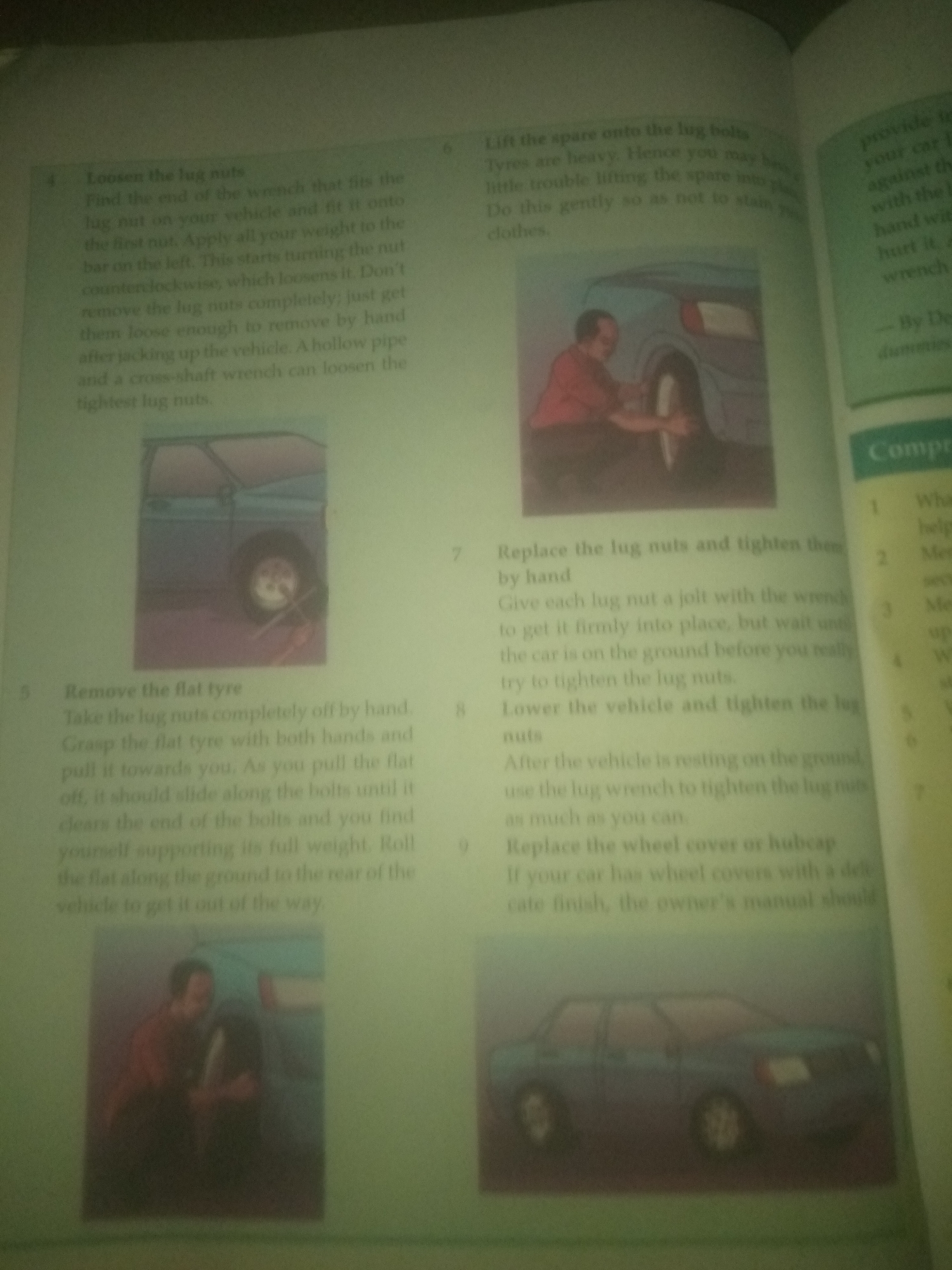 The image shows a page from a book detailing how to change a car tire. There are numbered steps with accompanying illustrations.
Step 4, "Loosen the lug nuts," is described with text and an illustration of a car tire with lug nuts.
Step 5, "Remove the flat tyre," is described with text and an illustration of a car tire being removed.
Step 6, "Lift the spare onto the lug bolts," is described with text and an illustration of a person lifting a tire onto lug bolts.
Step 7, "Replace the lug nuts and tighten them by hand," is described with text.
The text then instructs to lower the vehicle and tighten the lug nuts with a wrench.
Step 9, "Replace the wheel cover or hubcap," is described with text, followed by an illustration of a car.
The provided image does not contain any information or visual elements related to the city of Jauro Yinu, Nigeria. The scene is entirely confined to the content of the book.