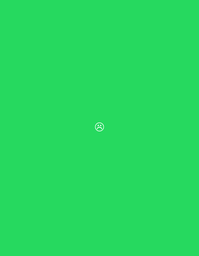 The image displays a uniform, solid field of vibrant green color. Centrally positioned within this green expanse is a small, white outline graphic depicting a frowning face emoji. No other discernable subjects, objects, people, or actions are present in the scene. The environment is entirely monochromatic and devoid of any identifiable geographical features, structures, or cultural elements.