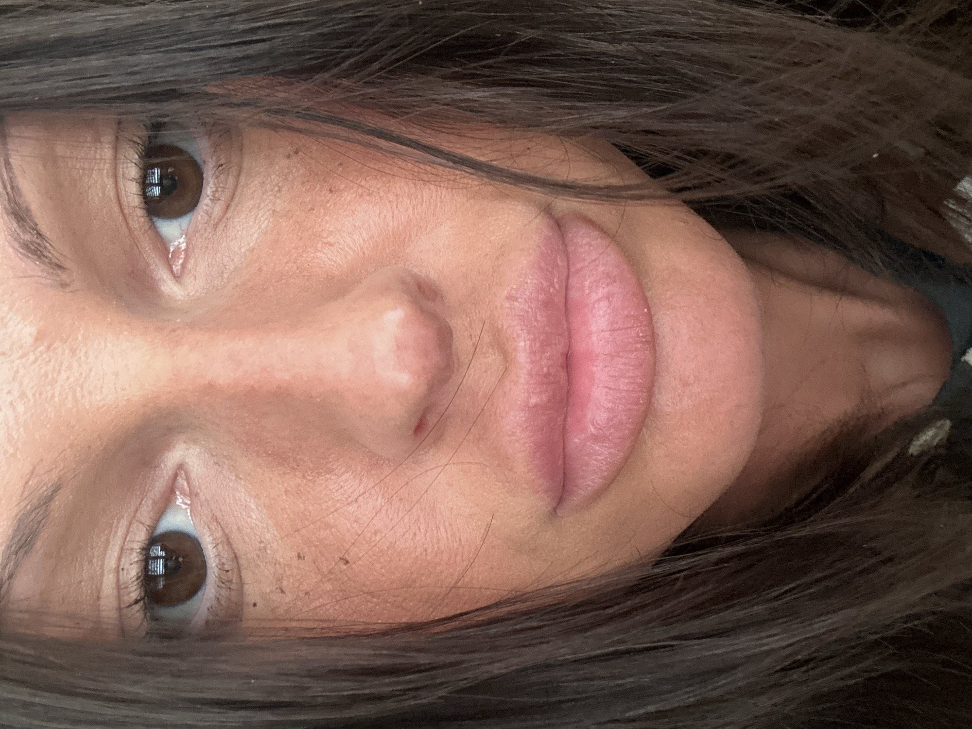 A close-up of a face with brown eyes and brown hair. The person is fair-skinned, with full lips. There is no visible indication of the image's location being in Tunbridge Wells, United Kingdom.