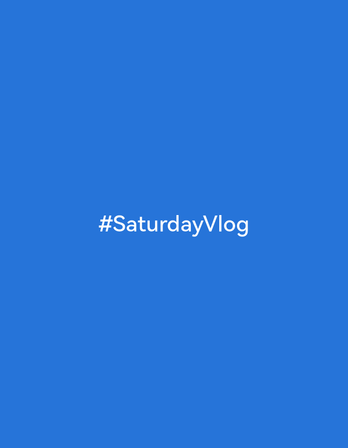 The image is a digital graphic with the text "#SaturdayVlog" displayed in white font against a solid blue background. There are no people, objects, actions, or interactions depicted, and the scene is entirely digital and lacks any identifiable location in Vidnoye, Russia, or any other real-world setting.