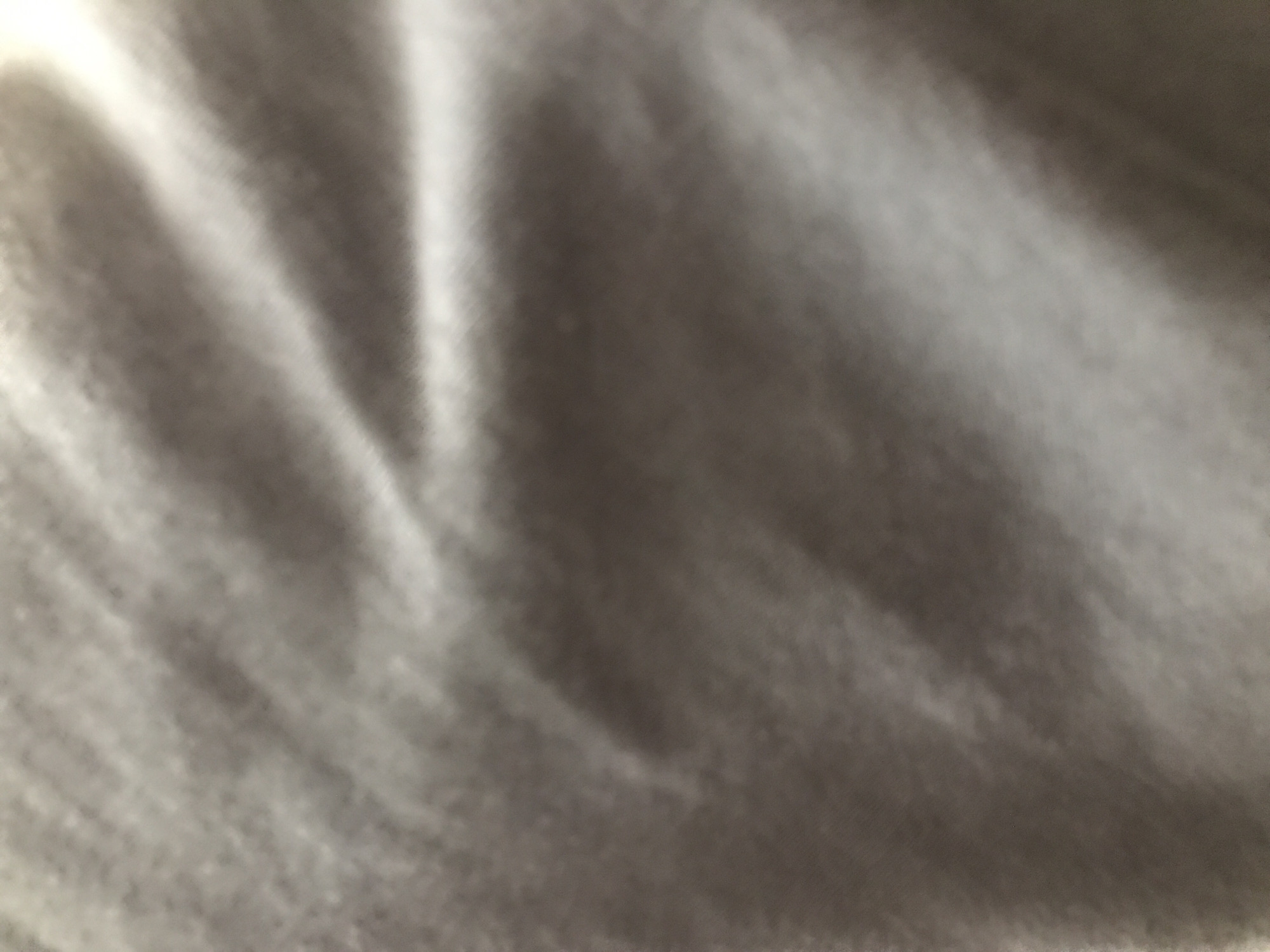 The image shows a close-up of a wrinkled, light-colored fabric. The texture appears soft and slightly blurred. No other details are visible, so no information about Yerevan, Armenia can be inferred.