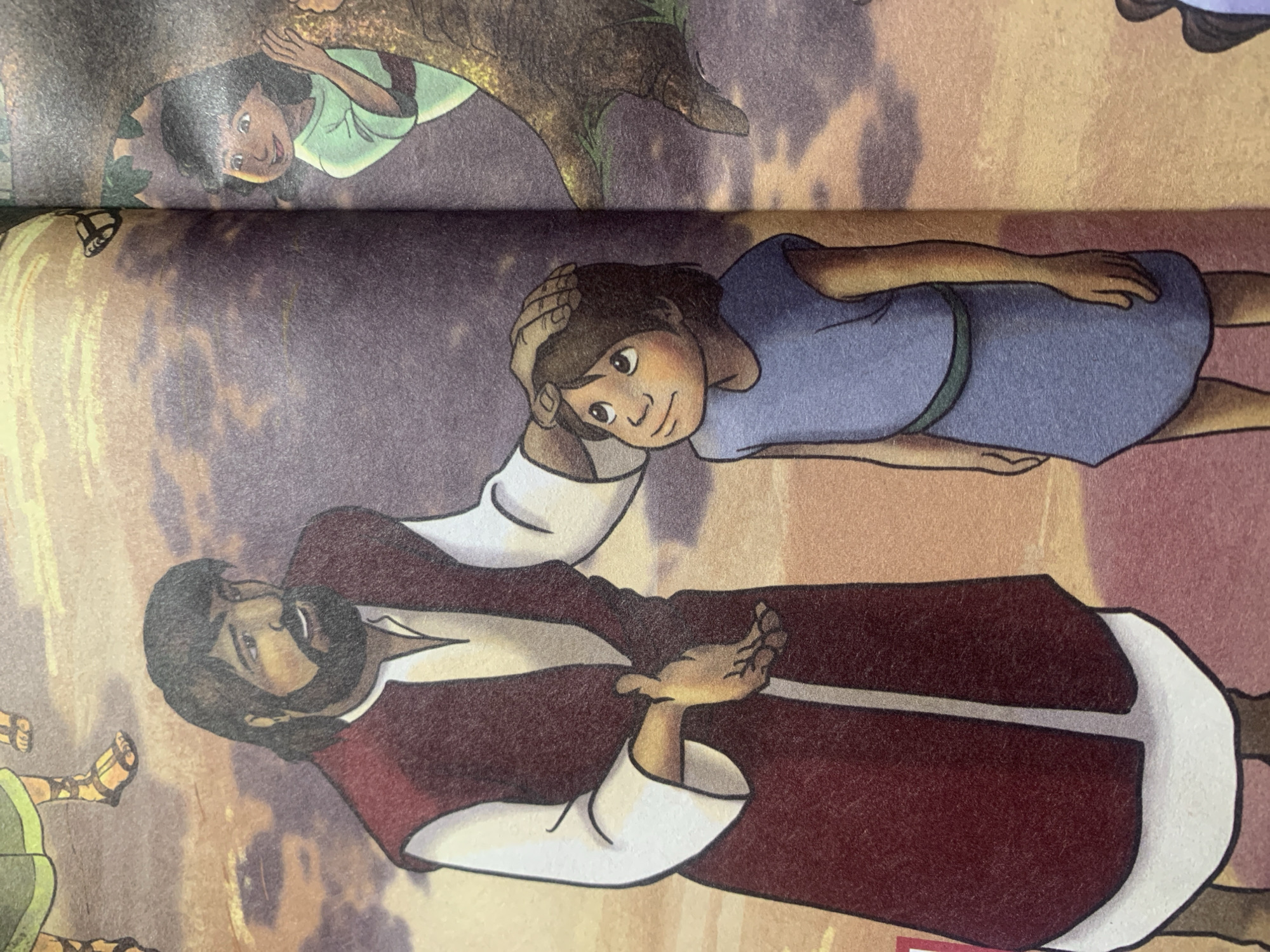 The image depicts an illustration of two individuals, an adult male and a child, in an outdoor setting. The adult male, with dark hair and a beard, is wearing a maroon robe over a white garment and has his hand placed on the child's head. The child, dressed in a blue tunic with a green sash, is looking up at the adult male. In the background, a young girl peeks from behind a tree. The environment appears to be somewhat stylized, with a reddish-brown ground and a dusky sky with clouds. The presence of sandals on some figures suggests a historical or biblical context. The location in the city of Jauro Yinu, Nigeria, is not discernible from the provided image.