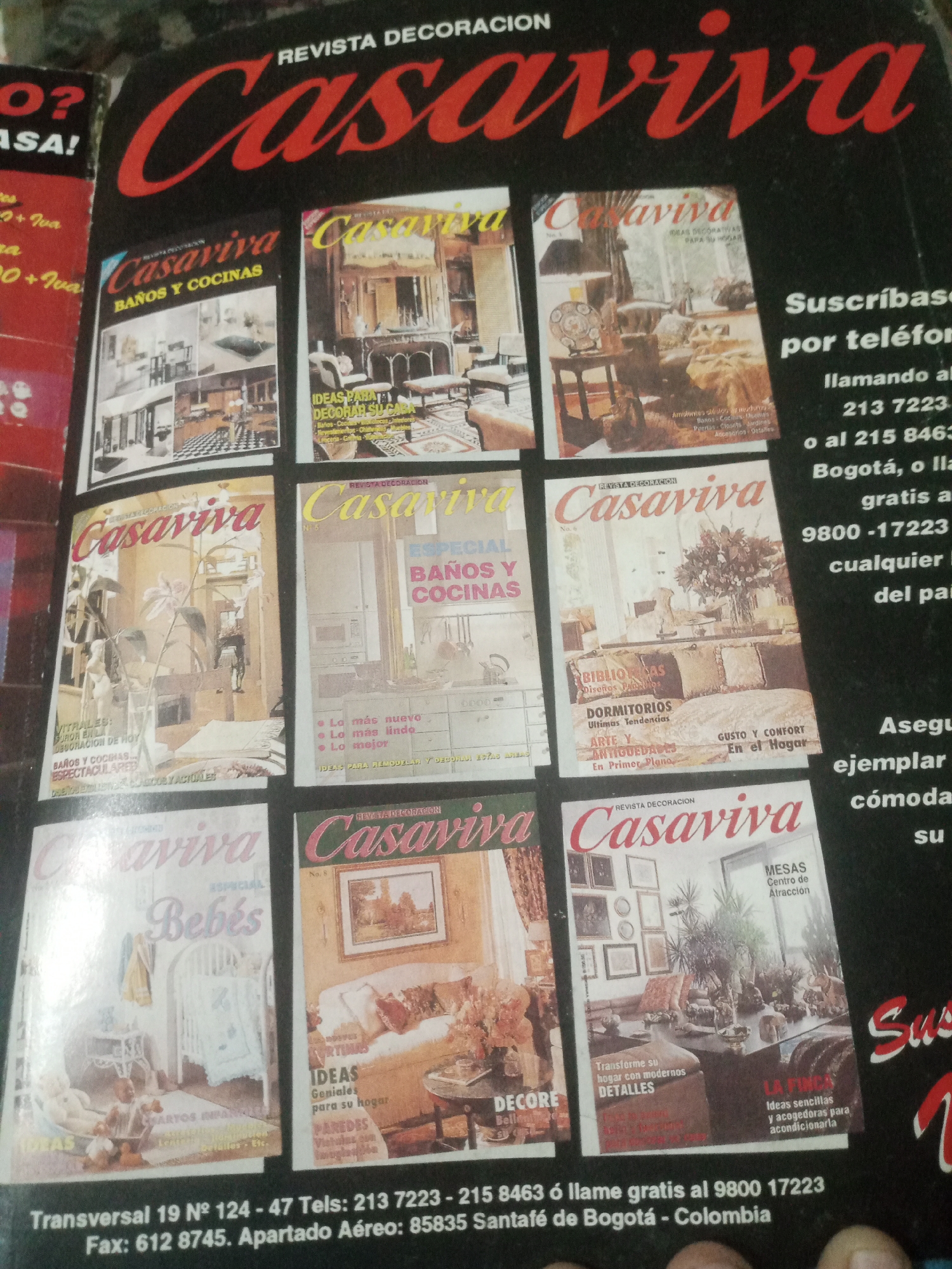The image is a photograph of a magazine spread, likely an advertisement for the magazine "Casaviva" which focuses on decoration. The magazine cover features various interior design and home decor images. Prominently displayed are the title "Casaviva" in large, red, stylized lettering. Multiple smaller magazine covers are visible, each showcasing different themes like bathrooms, kitchens, bedrooms, and living spaces.
Text elements include subscription information, phone numbers, and a physical address: "Transversal 19 № 124 - 47 Tels: 213 7223 - 215 8463 ó llame gratis al 9800 -17223 Fax: 612 8745. Apartado Aéreo: 85835 Santafé de Bogotá - Colombia."
The text specifies "Santafé de Bogotá - Colombia" as the location associated with the magazine's contact information and postal address. There is no mention or visual indication of Santa Ana, Venezuela in the image. The scene is a flat lay or a staged product shot of the magazine, with no discernible environmental details beyond what is presented on the magazine pages themselves. No people are present in the image, only photographs of interiors.