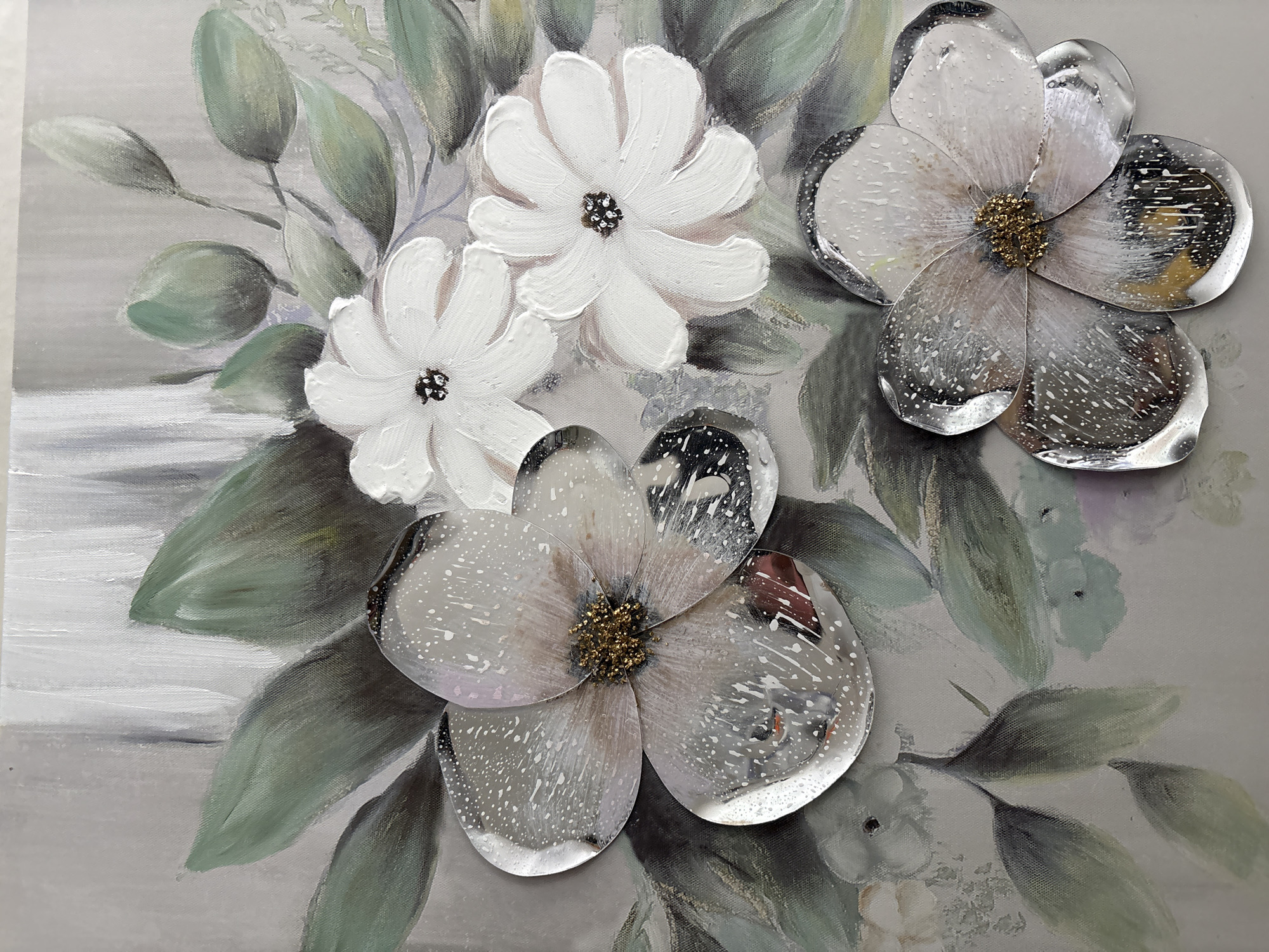 The image is a close-up of a floral painting. The painting features a bouquet of flowers against a grey background. There are two white, painted flowers in the upper left. To the right and in the lower center are two flowers with translucent petals and golden centers. The leaves are painted in shades of green and grey. The painting has texture. There is no indication of Plovdiv, Bulgaria.