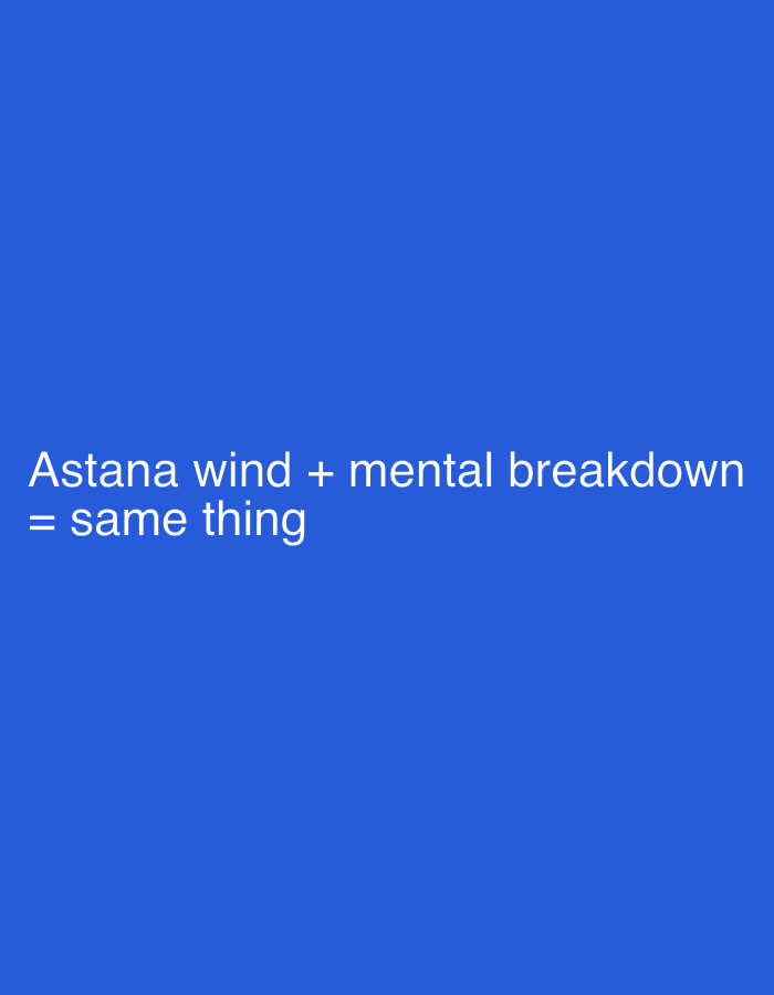 The image displays a plain, solid blue background. White text is superimposed on the lower half of the image. The text reads: "Astana wind + mental breakdown = same thing". There are no people, subjects, objects, actions, or interactions depicted, nor any recognizable environmental features of Astana, Kazakhstan.