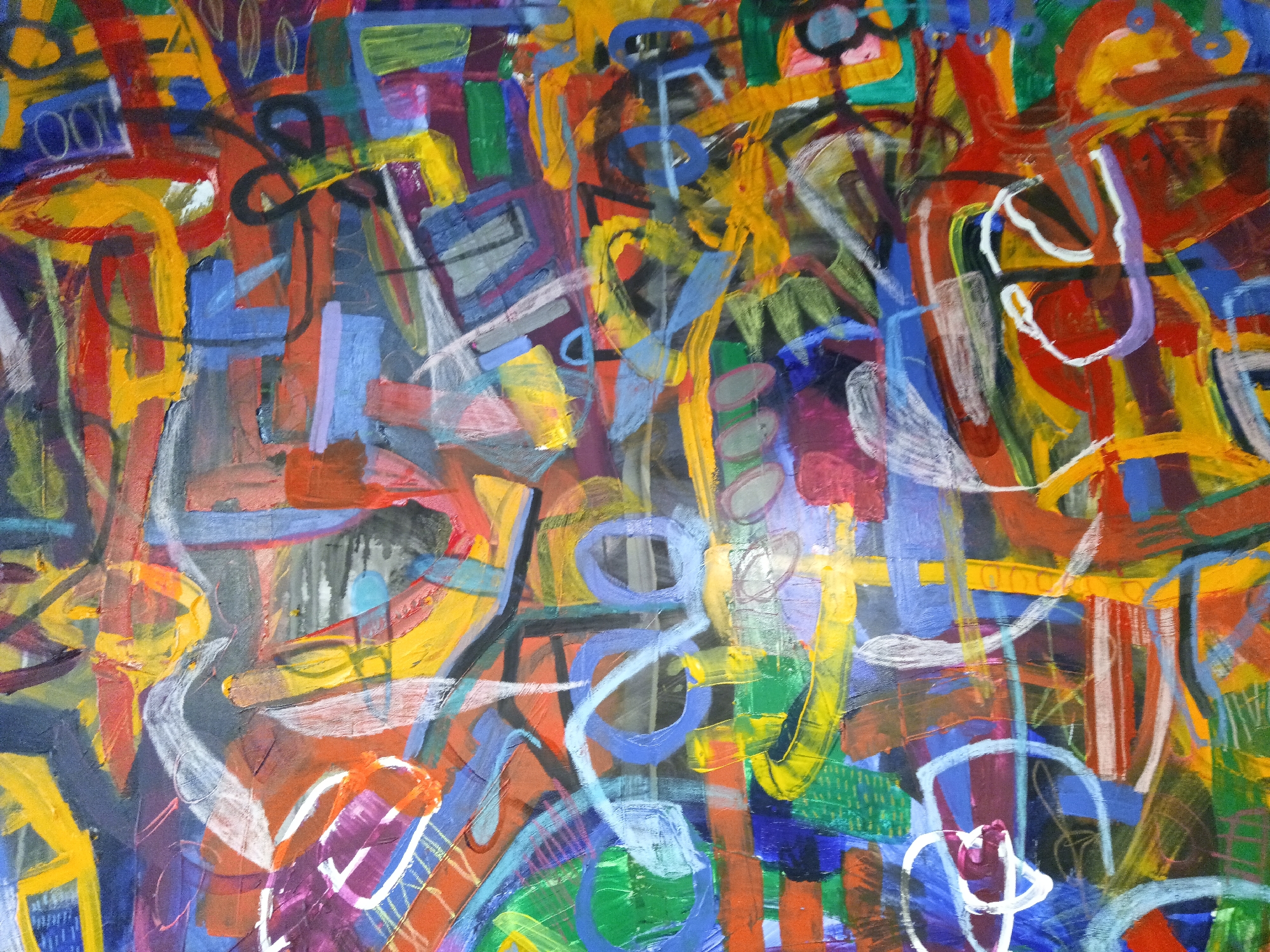 The image is an abstract painting with bold, energetic brushstrokes and a vibrant palette of colors. It features overlapping shapes, lines, and textures in shades of red, yellow, blue, green, purple, and orange, with some areas of white and grey. The composition is complex and chaotic, with no discernible subject matter or narrative. The painting appears to be a close-up view of a canvas, showing the texture of the paint and the layering of colors. There is no information within the image to suggest it is located in Kuala Lumpur, Malaysia, or any other specific location.