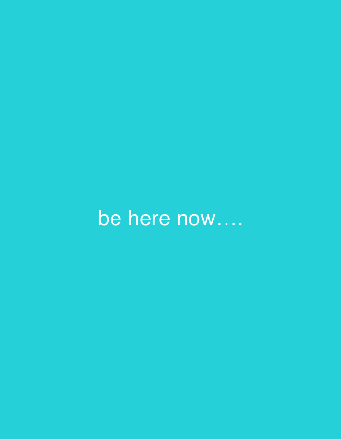 The image is a light turquoise background with the text "be here now...." in white letters. The text is centered horizontally and vertically in the image. The image contains no objects or people. The image has no location data. Kuta Selatan, Indonesia, is not depicted in the image.